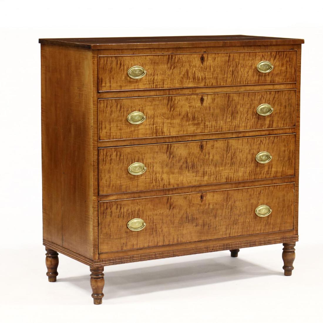 American Sheraton Tiger Maple Chest of Drawers: American Sheraton Tiger Maple Chest of Drawers circa 1820, walnut and poplar secondary, cherry top, four graduated and cock beaded drawers with mahogany inlaid escutcheons, reeded skirt on turned legs