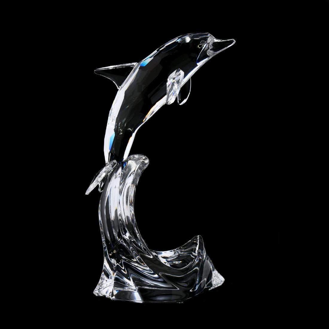 Swarovski, South Sea Maxi Dolphin, Retired: Swarovski, South Sea Maxi Dolphin, Retired item #221628, clear faceted and molded crystal with colored eyes, with case and box, signed. 8 x 5 x 3.5 in. Collection of Stephen Coppala, Charlotte, North 