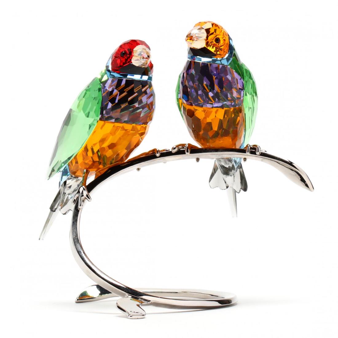 Swarovski, Gouldian Finches: Swarovski, Gouldian Finches item #1141675, two peridot finches with multi color and faceted bodies on white metal mounts, marked, with box. 4.75 x 5 x 4 in. Collection of Stephen Coppala, Charlotte, N