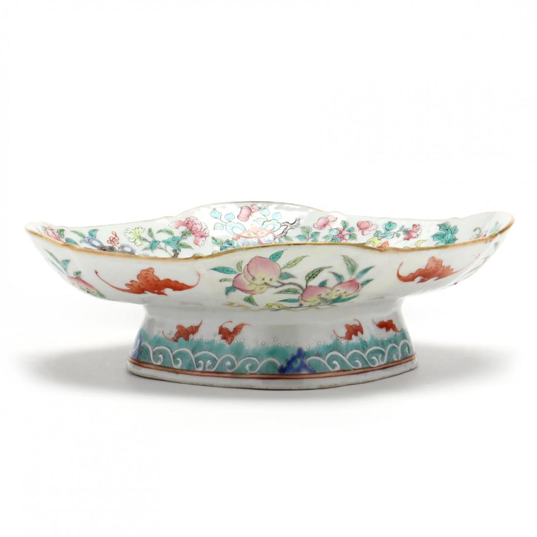 Chinese Porcelain Footed Dish: Chinese Porcelain Footed Dish and a footed serving dish in lozenge shape decorated with the Buddhist Treasures and peony blossoms, the underside of rim is decorated with auspicious bats and peaches, t