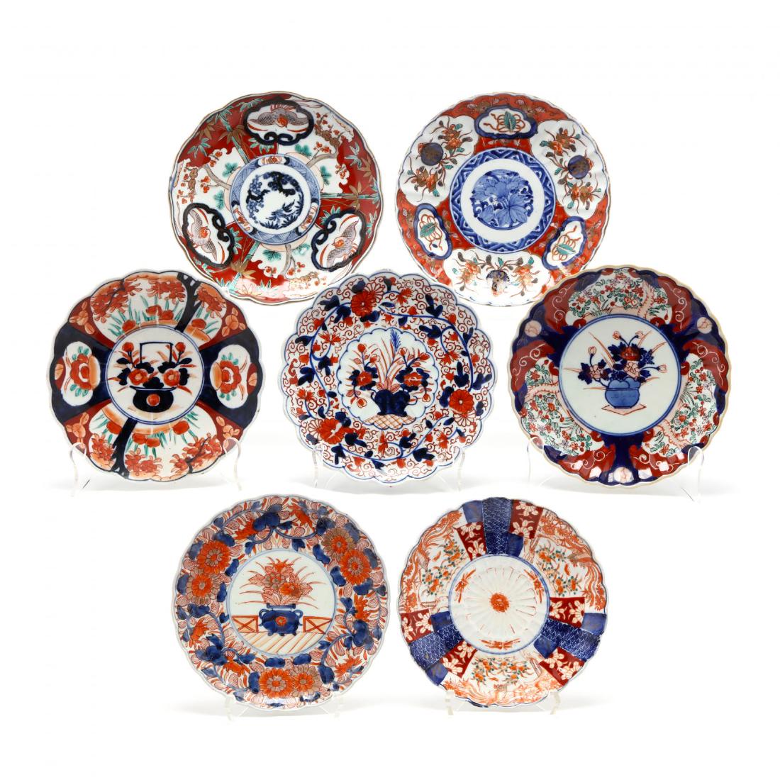 A Group of Seven Antique Imari Plates: A Group of Seven Antique Imari Plates Meiji Period, circa 1870s, each with different decoration in traditional colors, scalloped rims. 9 in. Additional high-resolution photos are available at LelandLi