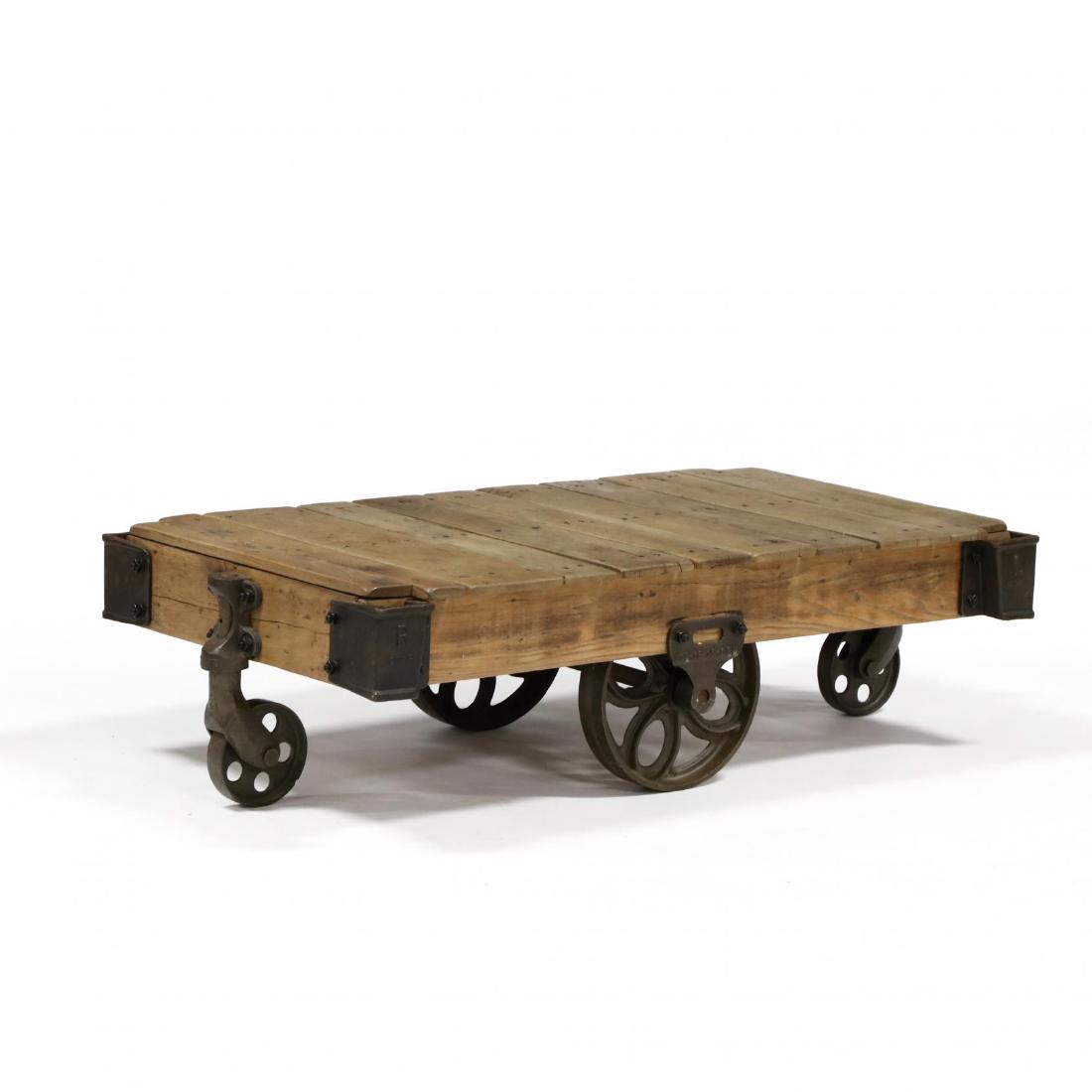Restored Factory Cart Coffee Table: Restored Factory Cart Coffee Table early 20th century oak and iron with full restoration, reset and refinished. 14 x 28 x 51 in. From the Estate of the late William L. Bishop, Durham, North Carolina A
