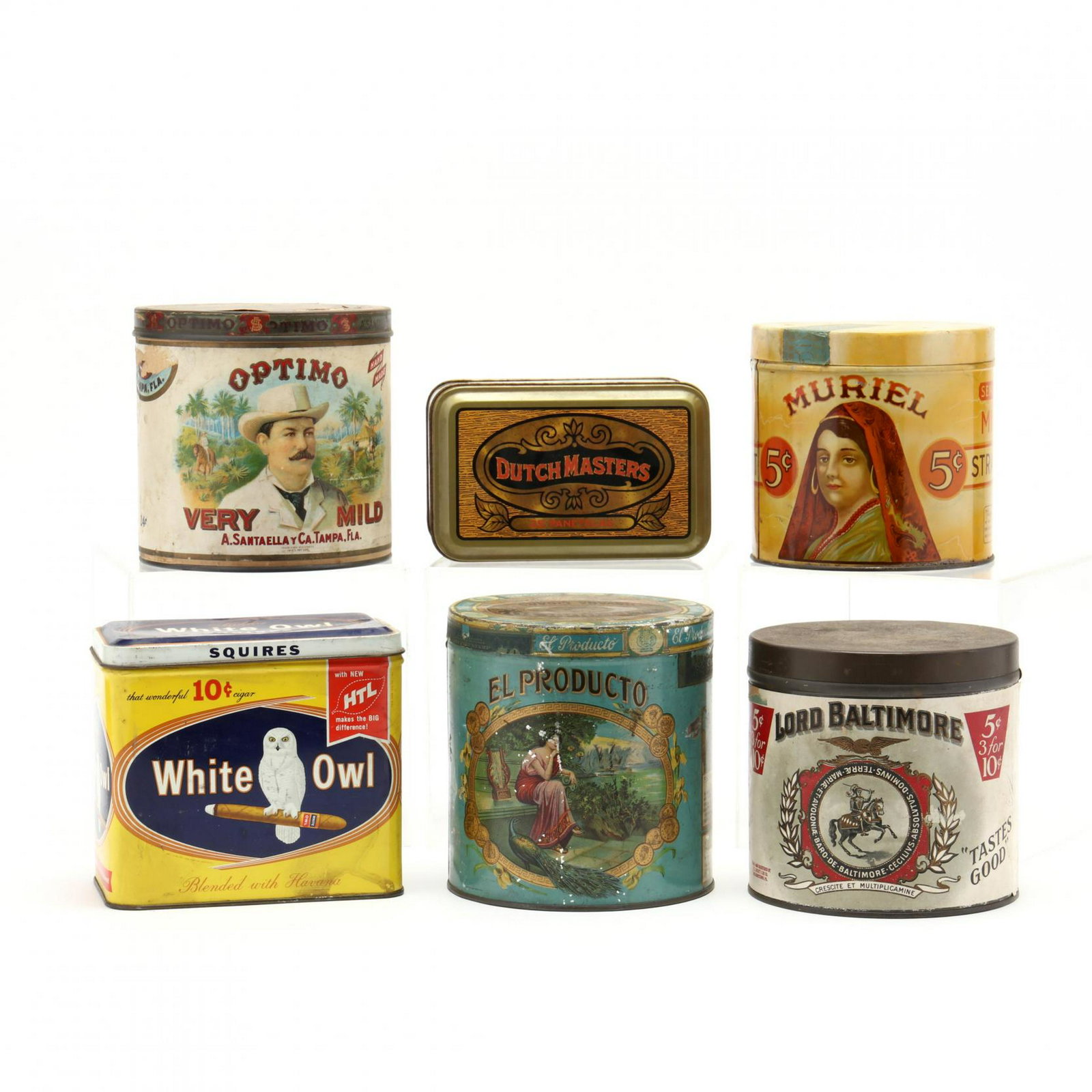 A Group of Six Vintage Cigar Tins: A Group of Six Vintage Cigar Tins to include; El Producto, Havana; Optimo; White Owl; Muriel (holes punched in lid); Dutch Masters; Lord Baltimore. Muriel 6 in. From the Collection of Mary Wells, Gree
