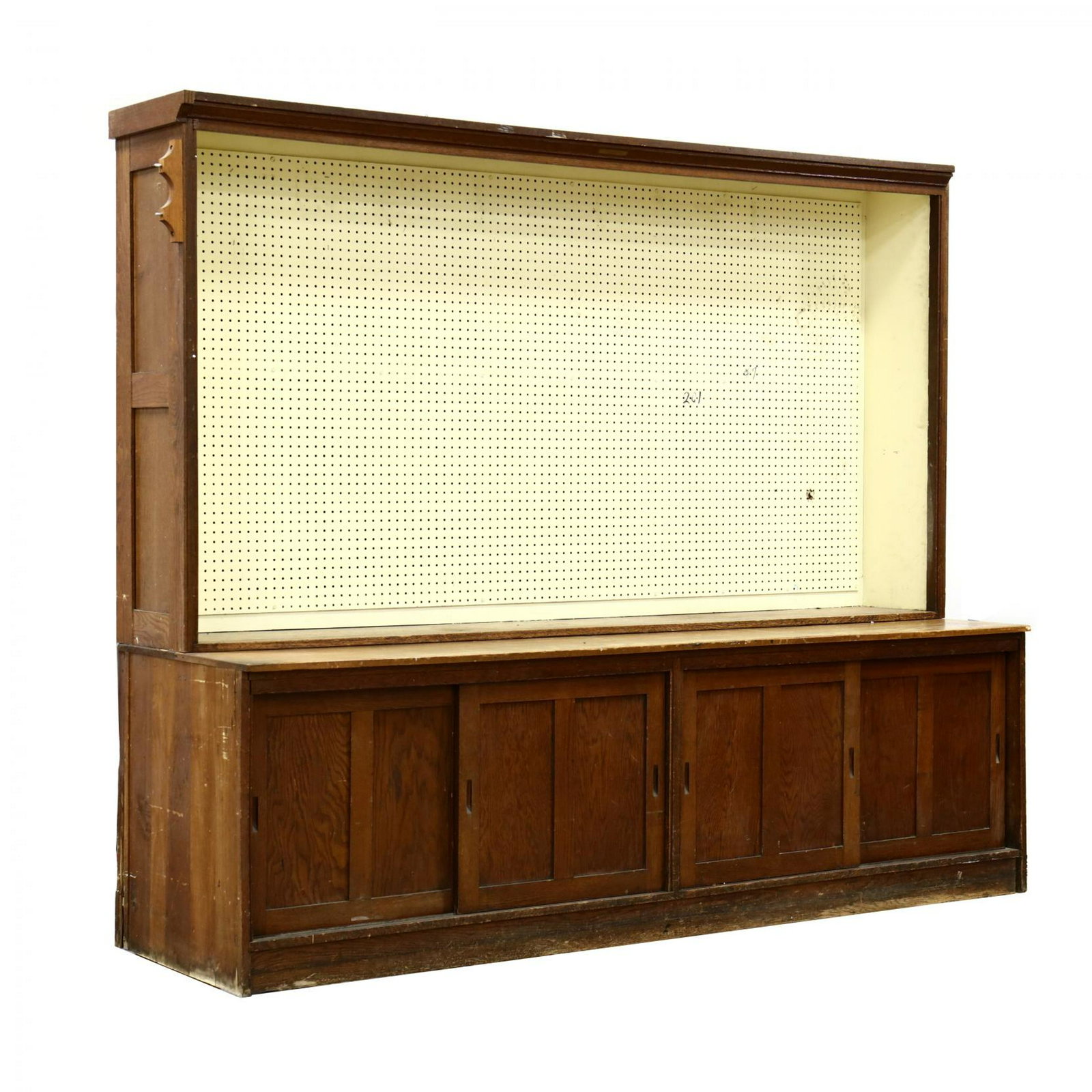 Large Antique Country Store Flat-Wall Cabinet: Large Antique Country Store Flat-Wall Cabinet F.D. Warren Mfg., Chicago, circa 1890, two part oak case with upper open cabinet having later painted pegboard; lower cabinet with four hinged sliding pan
