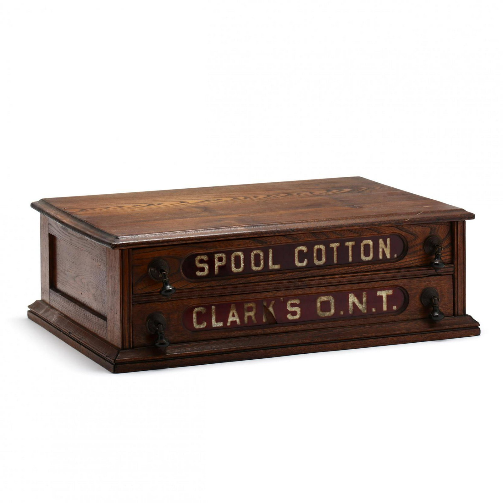 Clark's O.N.T. Table-Top Spool Cabinet: Clark's O.N.T. Table-Top Spool Cabinet late 19th century, oak case, two drawers with red/clear glass panels, original drop pulls, flush molded base. 8 x 22 x 15 in. From the Collection of Mary Wells, 
