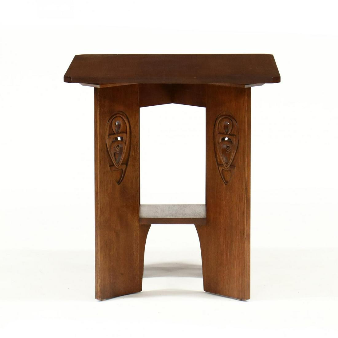 Stickley, Contemporary Carved Mission Oak Occasional: Stickley, Contemporary Carved Mission Oak Occasional Table quarter sawn oak, square top with canted corners, raised on four relief carved and reticulated legs, with lower shelf, labeled. 26.25 x 24 x 