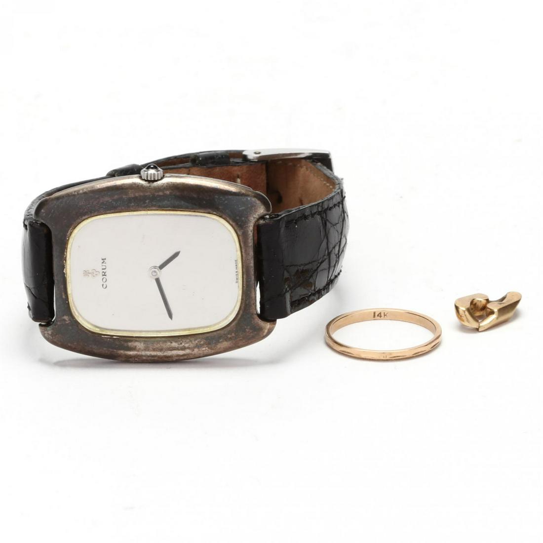 Group of Jewelry Items: Group of Jewelry Items to include: a thin band (stamped 14K; ring size 6); a loose link component (tested 18KT; 1/2 in.); and a manual wind silver Corum watch with a silver tone face and a black leath
