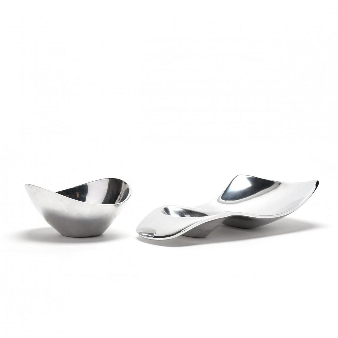 Nambe, Two Modernist Stainless Steel Serving Dishes: Nambe, Two Modernist Stainless Steel Serving Dishes to include a serving platter with recess and a nut bowl, marked. Larger 3.25 x 15.5 x 9 in. Estate of the late Jo Ann Schwartz, Raleigh, North Carol