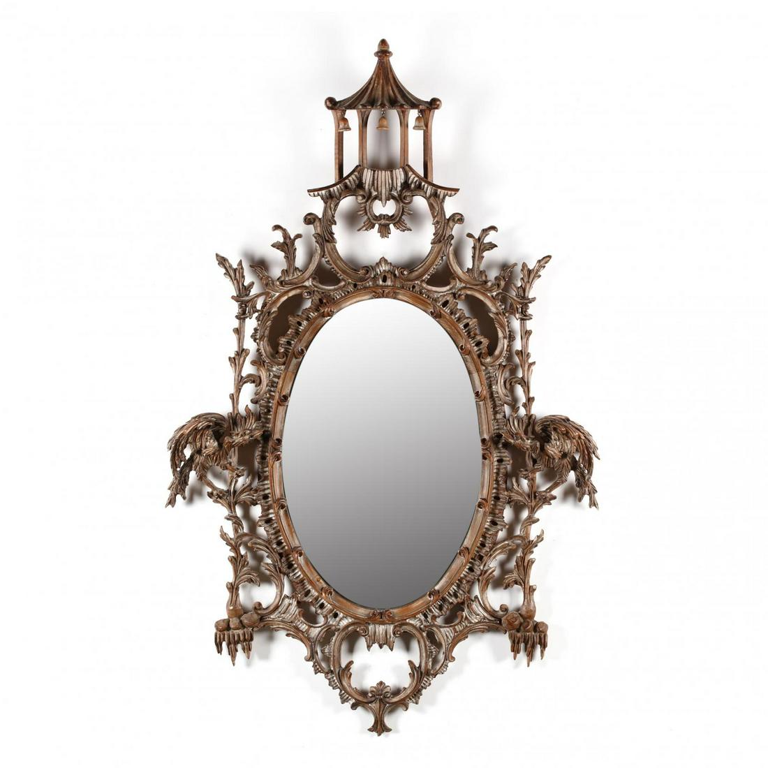 Chinese Chippendale Style Carved Wood Looking Glass: Chinese Chippendale Style Carved Wood Looking Glass mid 20th century, carved pine with an antiqued white wash, well developed oval frame with pagoda having drop bells, ornately scrolled acanthus leaf 