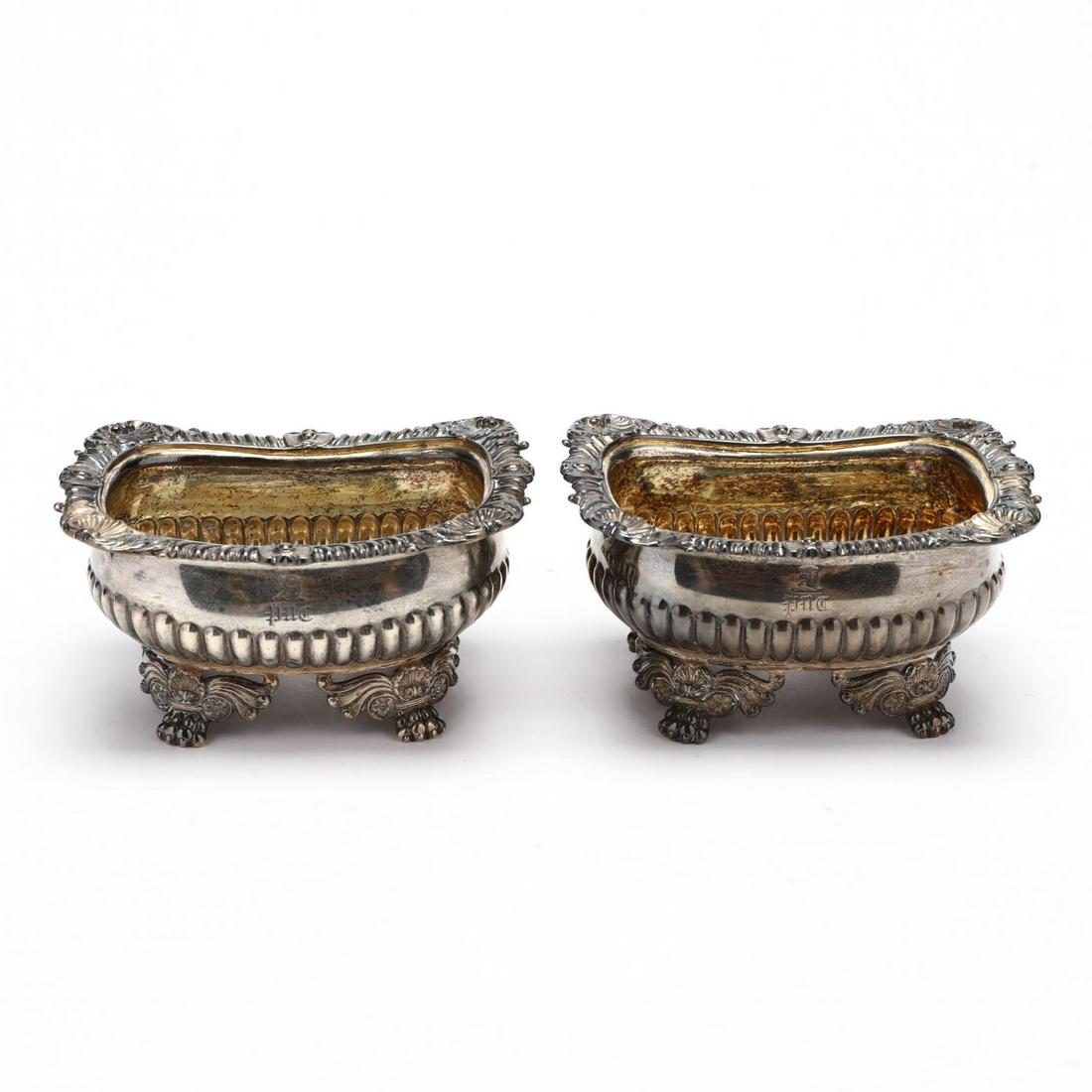 A Pair of George III Silver Master Salts: A Pair of George III Silver Master Saltsobscured sponsor's mark, London (1820), rectangular form raised on shell and scroll brackets with paw feet, bold gadrooning and shells to rim, each with period