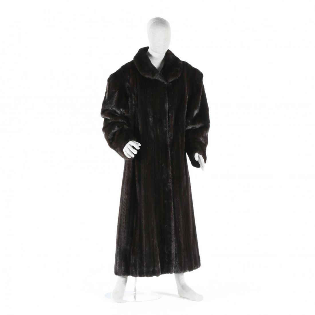 Full Length Dark Brown Mink Coat: Full Length Dark Brown Mink Coatfemale skins, designed with a Peter Pan collar, hook and eye closures, straight sleeves, shoulder pads, lined and embroidered with former owner's name. Fits XXL. Should