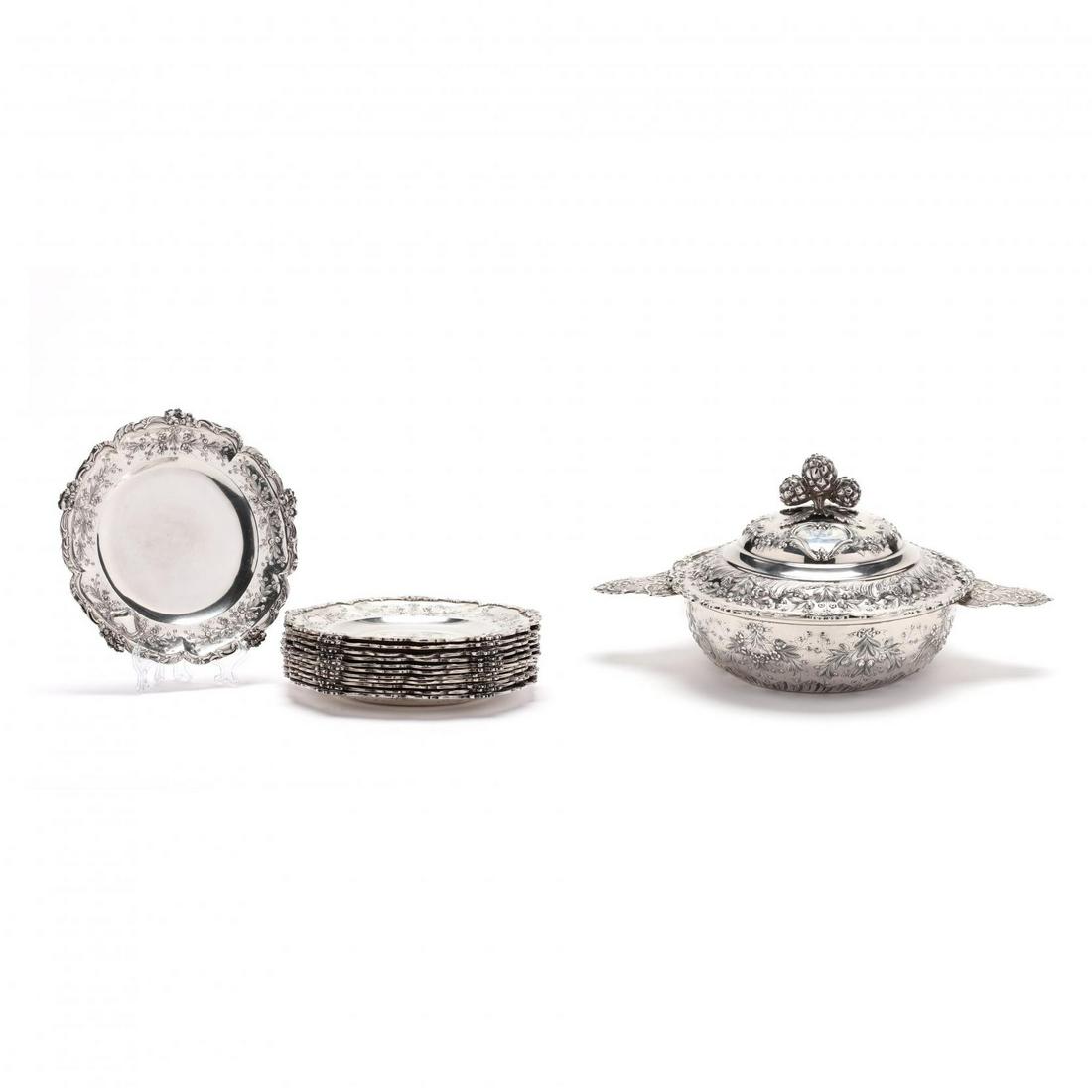 A French Silver Ìäcuelle and Dessert Service, Mark of: A French Silver Ìäcuelle and Dessert Service, Mark of Emile Delaire(active in Paris, 1882-1920), (13) pieces including: a large Ì©cuelle for serving (LOA 12.75 in.); a set of (12) dessert plates (