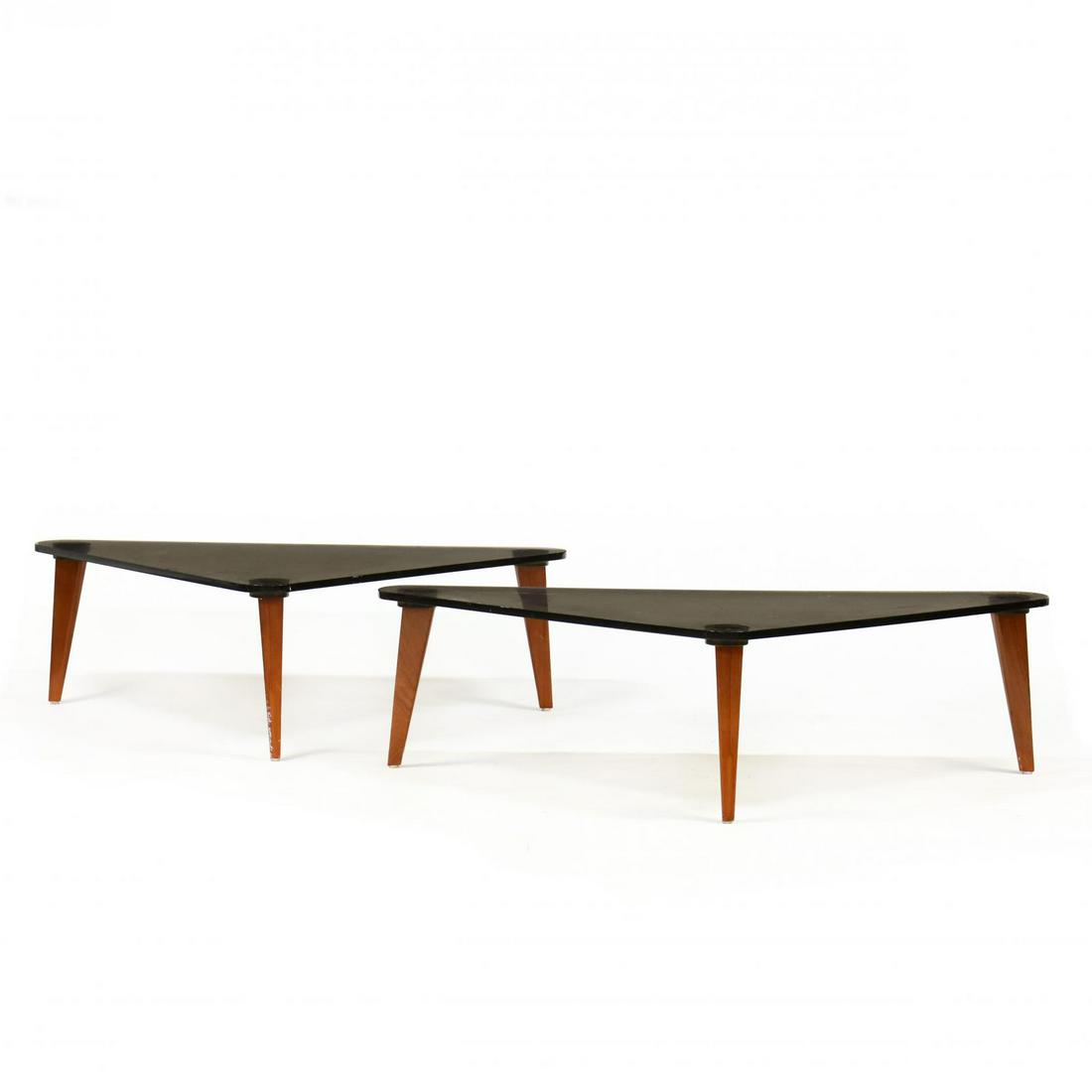 Pair of Modern Lucite and Mahogany Coffee Tables: Pair of Modern Lucite and Mahogany Coffee Tablespossibly by John Rybovich Jr., smoky triangular lucite tops, on splayed mahogany legs, unmarked. 16 x 50 x 33 in. Rybovich came from a line of well know