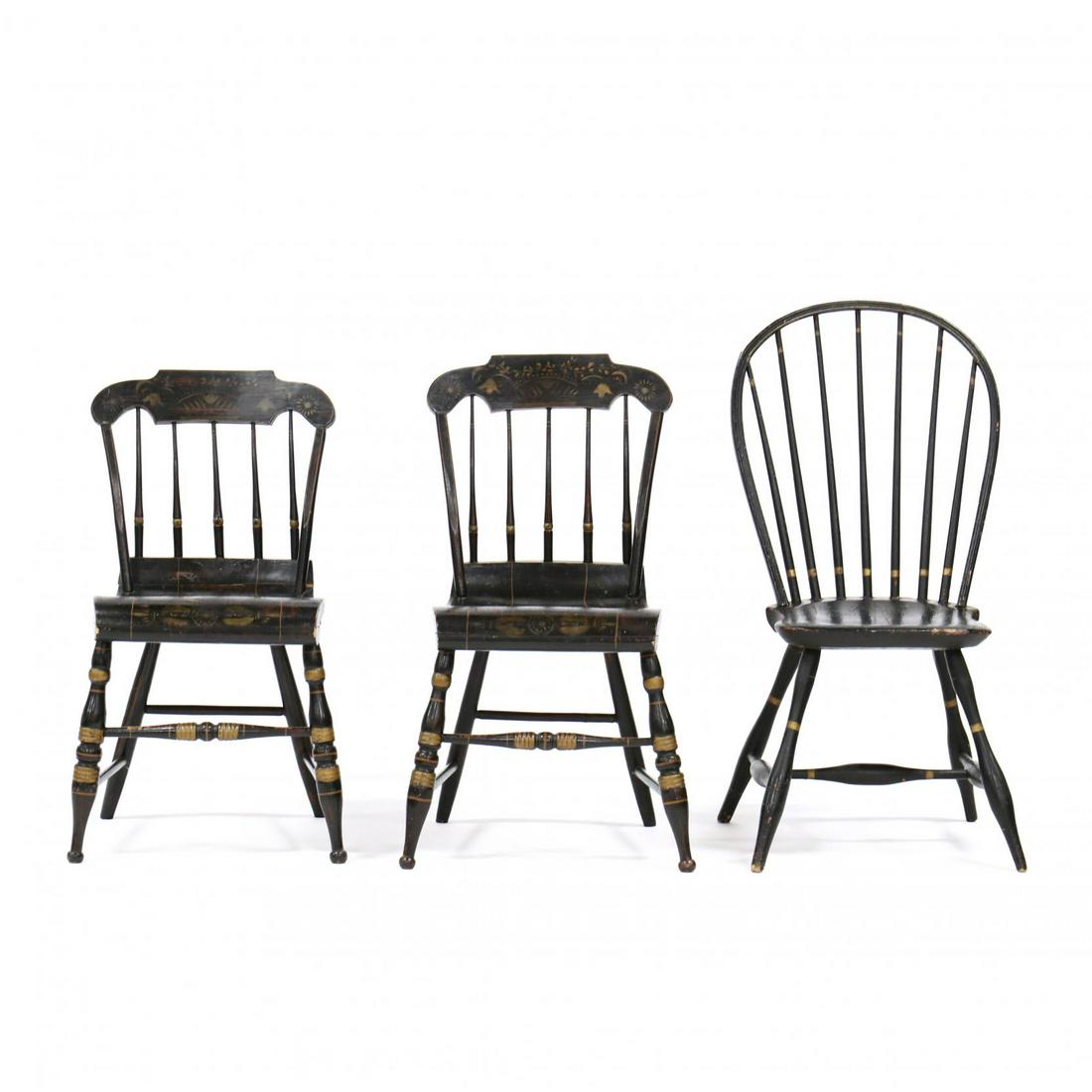 Three Antique American Painted Side Chairs: Three Antique American Painted Side Chairs19th century, each in black paint with gilt highlight, including a Windsor chair with seven spindles, shaped plank seat, on turned legs with stretcher base; t