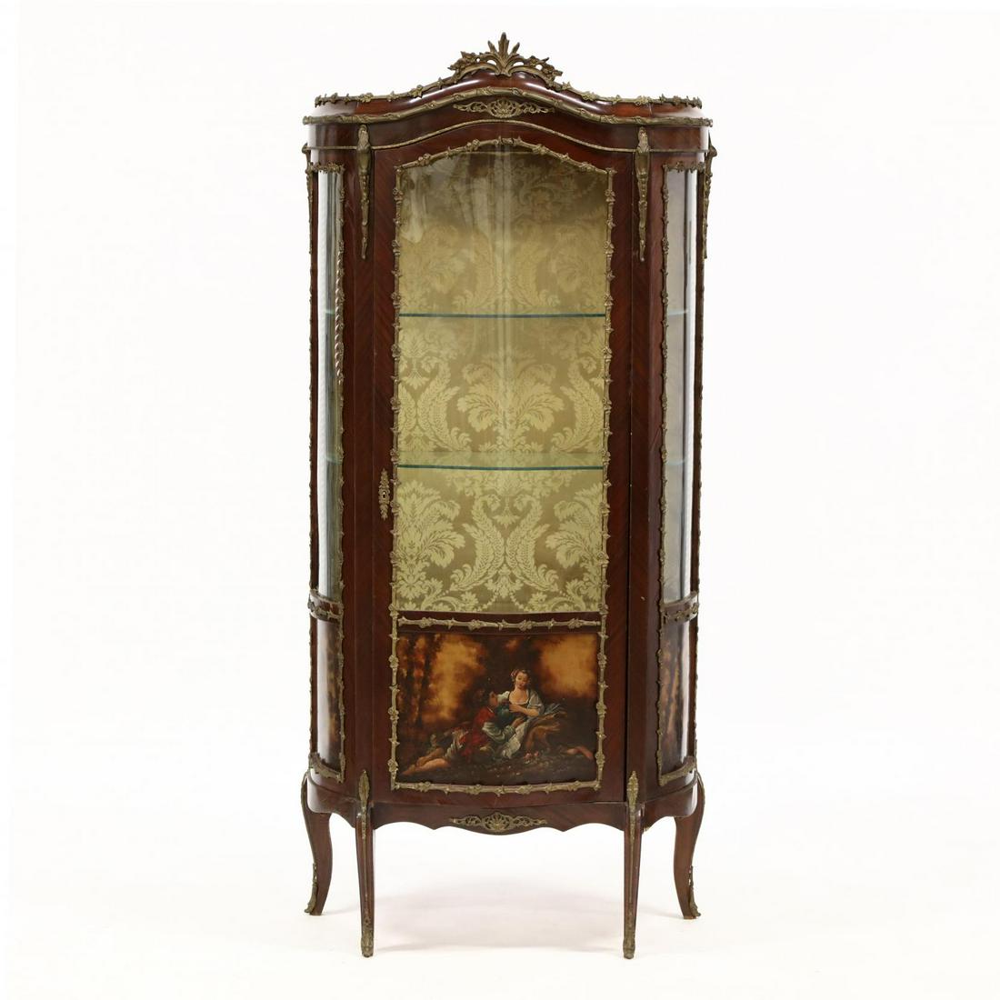 French Serpentine Front Ormolu Mounted and Painted: French Serpentine Front Ormolu Mounted and Painted Vitrine late 20th century, mahogany veneers, central hinged and glazed door with lower pastoral painted panel, golden damask upholstered interior wit
