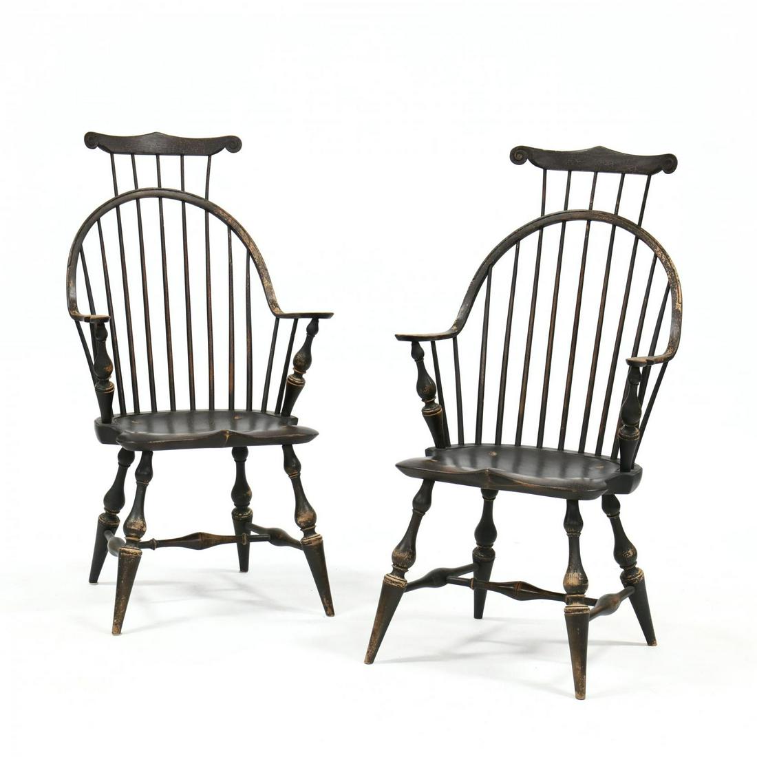 D.R. Dimes, Pair of Painted Windsor Armchairs: D.R. Dimes, Pair of Painted Windsor Armchairs mid 20th century, mixed woods, black paint with antiqued surface, shaped crestrail with scrolled ears, comb back with continuous arm, saddle seat, raised 