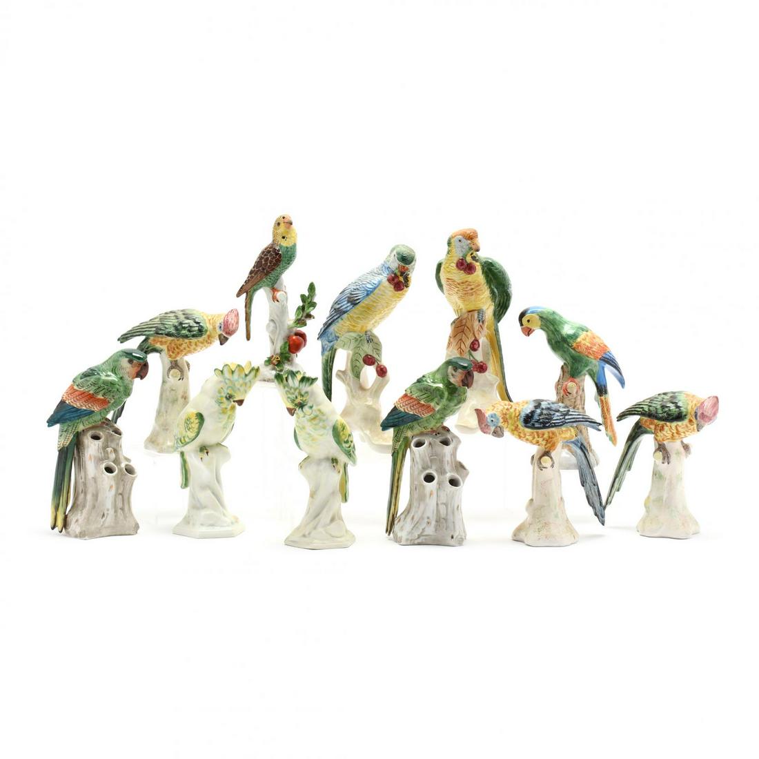 A Group of Eleven Continental Ceramic Parrots: A Group of Eleven Continental Ceramic Parrotssix marked "Italy", four are additionally labeled "Chelsea House"; two with crown mark of Capodimonte; two stamped "Portugal"; a porcelain parrot on cherry