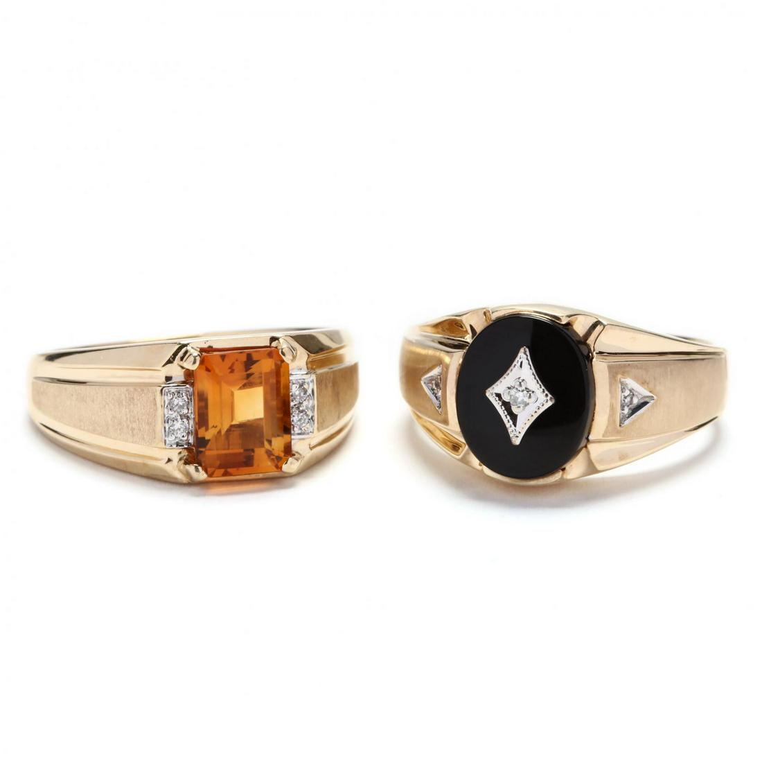 Two Gent's 10KT Gold and Gemstone Rings: Two Gent's 10KT Gold and Gemstone Rings to include: one set with an oval black onyx plaque set with a single cut diamond accent in white gold in the center and two single cut diamond accents on either
