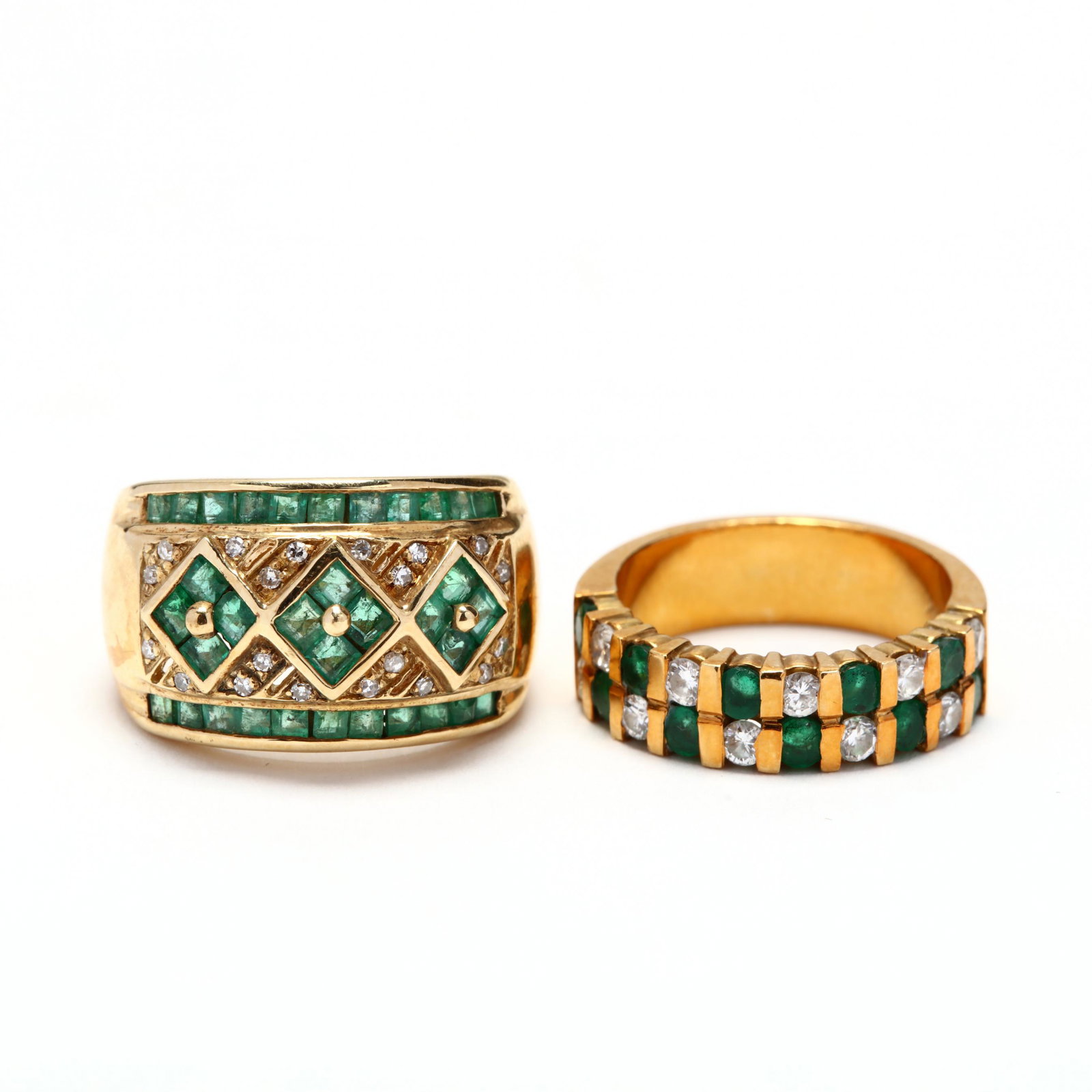 Two Gold, Diamond, and Emerald Rings: Two Gold, Diamond, and Emerald Ringsthe first in a double row band design with vertical channel set, alternating round cut emeralds weighing approximately .70 total carat and diamonds weighing approxi