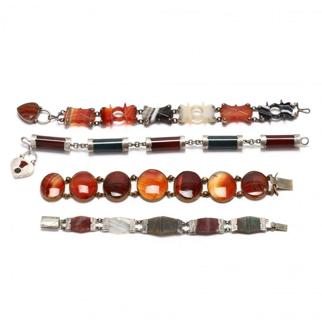Four Agate Link Bracelets: Four Agate Link Braceletsto include: a gold-tone bezel set oval agate link bracelet (1 1/16 x 7 in.); a tapered rectangular agate link bracelet with engraving detailing, silver content unknown (9/16 x
