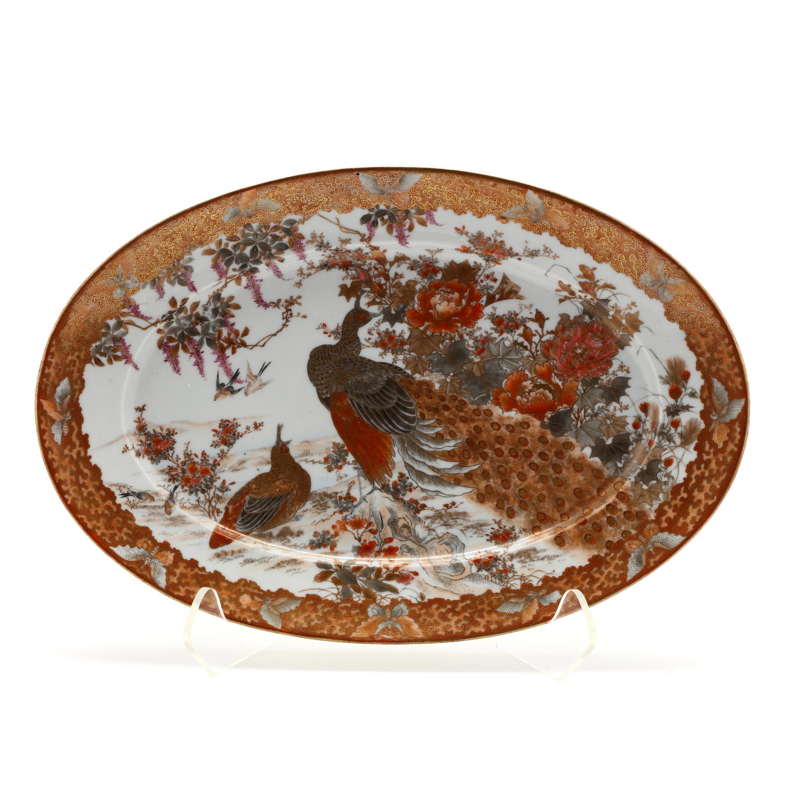 A Fine Japanese Satsuma Porcelain Platter: A Fine Japanese Satsuma Porcelain Platter 19th century, hand painted featuring a peacock in peonies with butterfly surround, underside rim with floral sprays, and with six character signature. 18 x 12