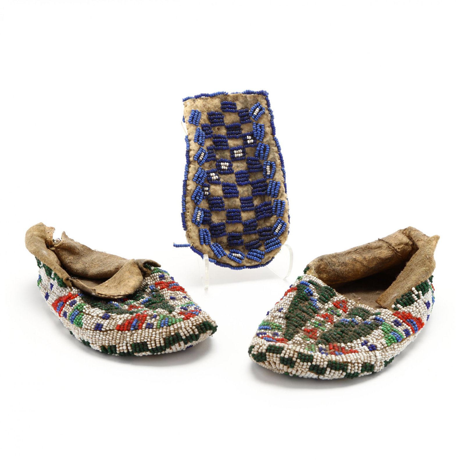 Native American Child's Beaded Moccasins and Purse: Native American Child's Beaded Moccasins and PurseWestern United States, 1930s -1940s, beadwork in five colors over the entire surface of the hide moccasins, including the soles (6 in.); plus a small