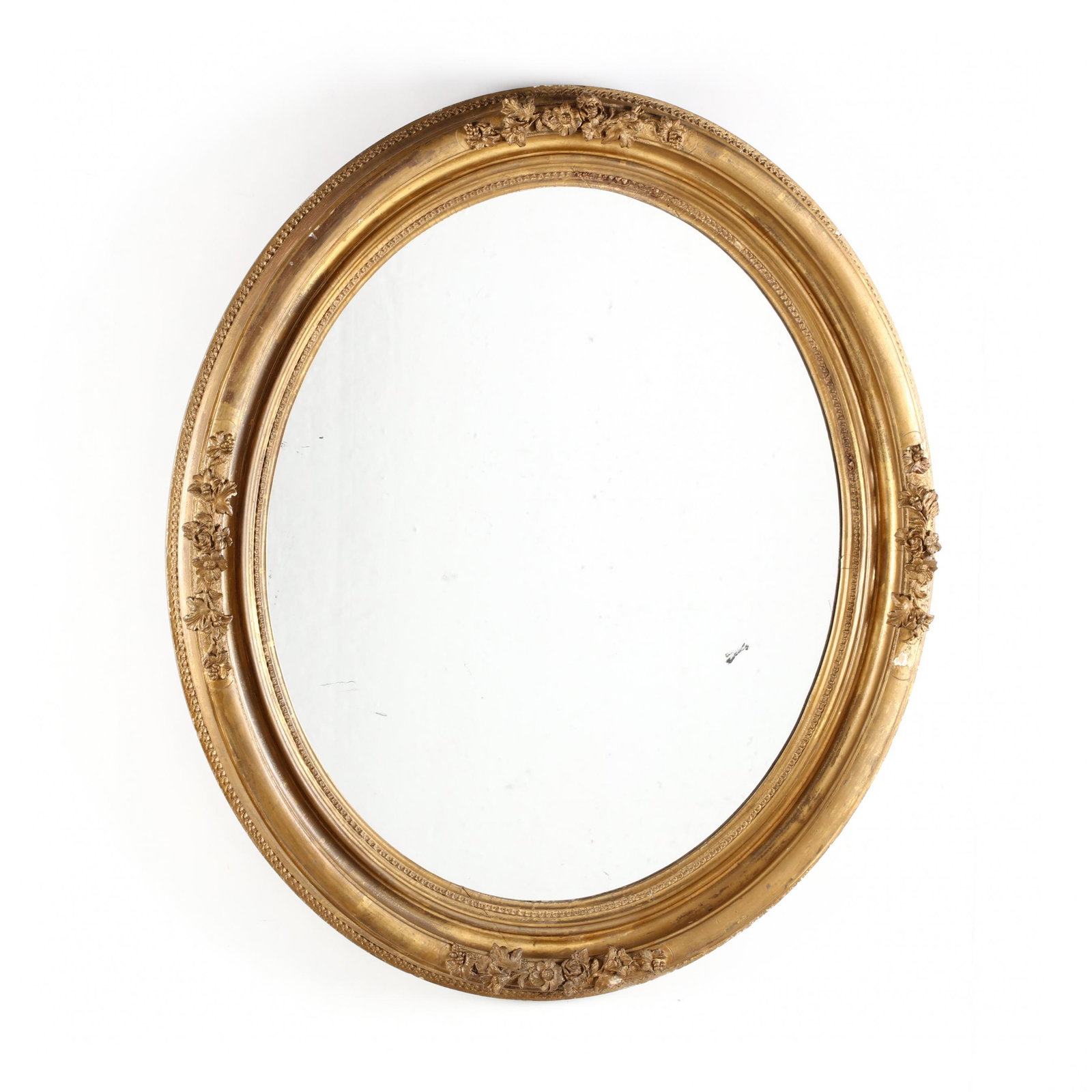 Antique Gilt Oval Mirror: Antique Gilt Oval Mirror late 19th century, wood and composition with floral relief carving. 38 x 33 in. Collection of a Gentleman, Easton, Maryland Additional high-resolution photos are available at 