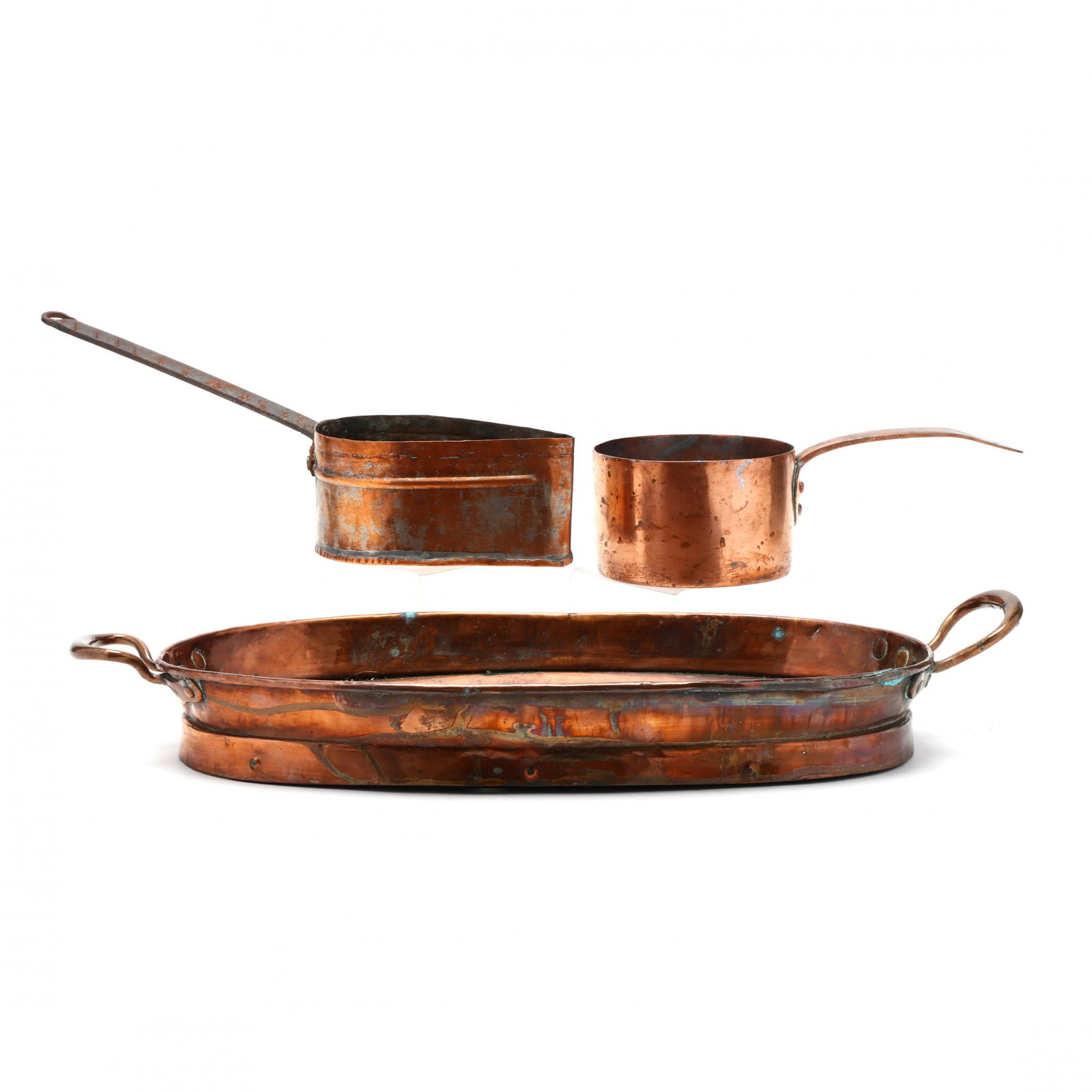 Three Antique Copper Pans: Three Antique Copper Pans 19th century, including a large double handled oval pan; a teardrop shaped handled pot; and a dovetailed solid copper pot with handle. Largest 24 x 11 in. Additional high-res