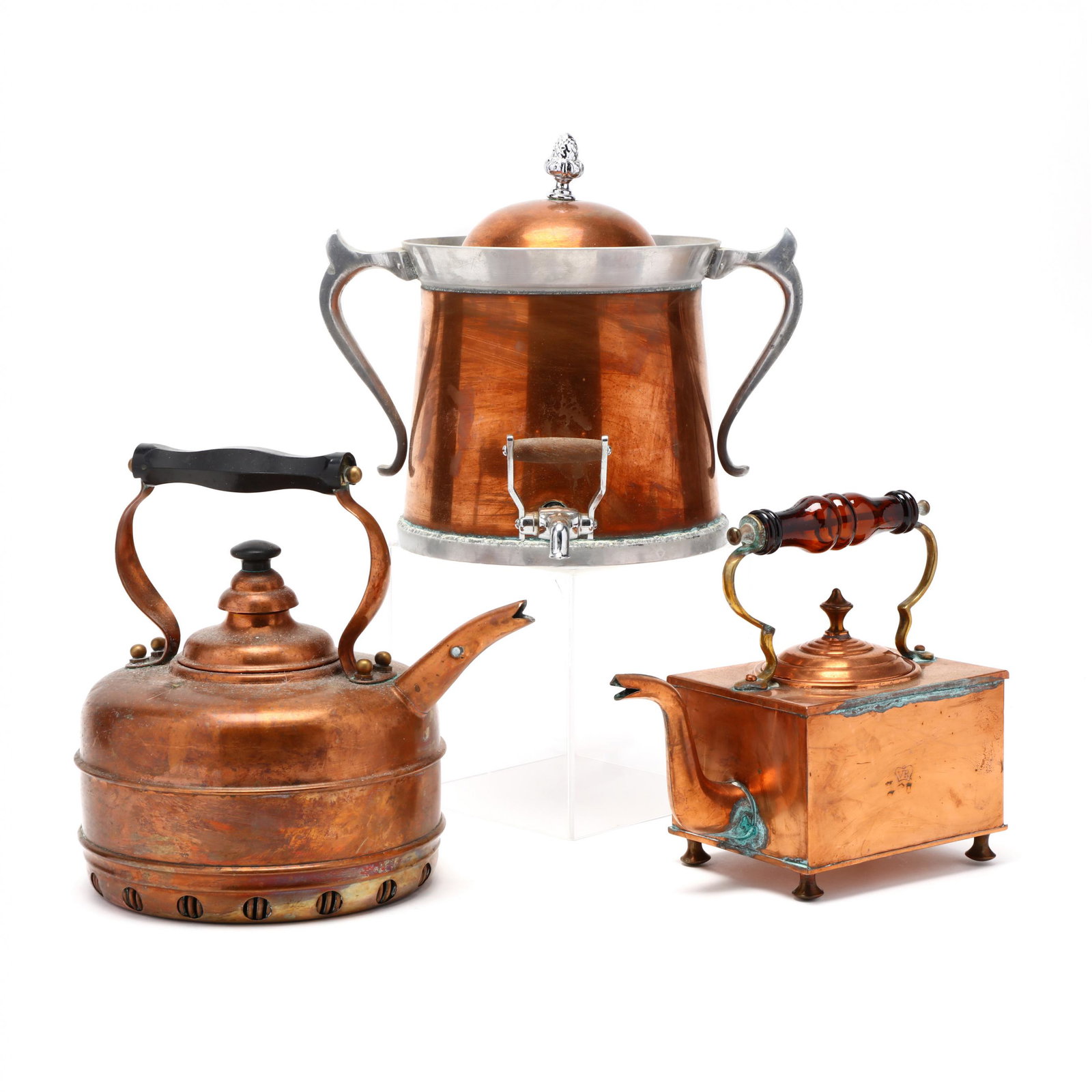 Two Copper Kettles and a Water Dispenser: Two Copper Kettles and a Water Dispenser including a box form 19th century copper kettle with amber glass handle; a late 19th century round kettle with patent warming coil base; and a 20th century cop