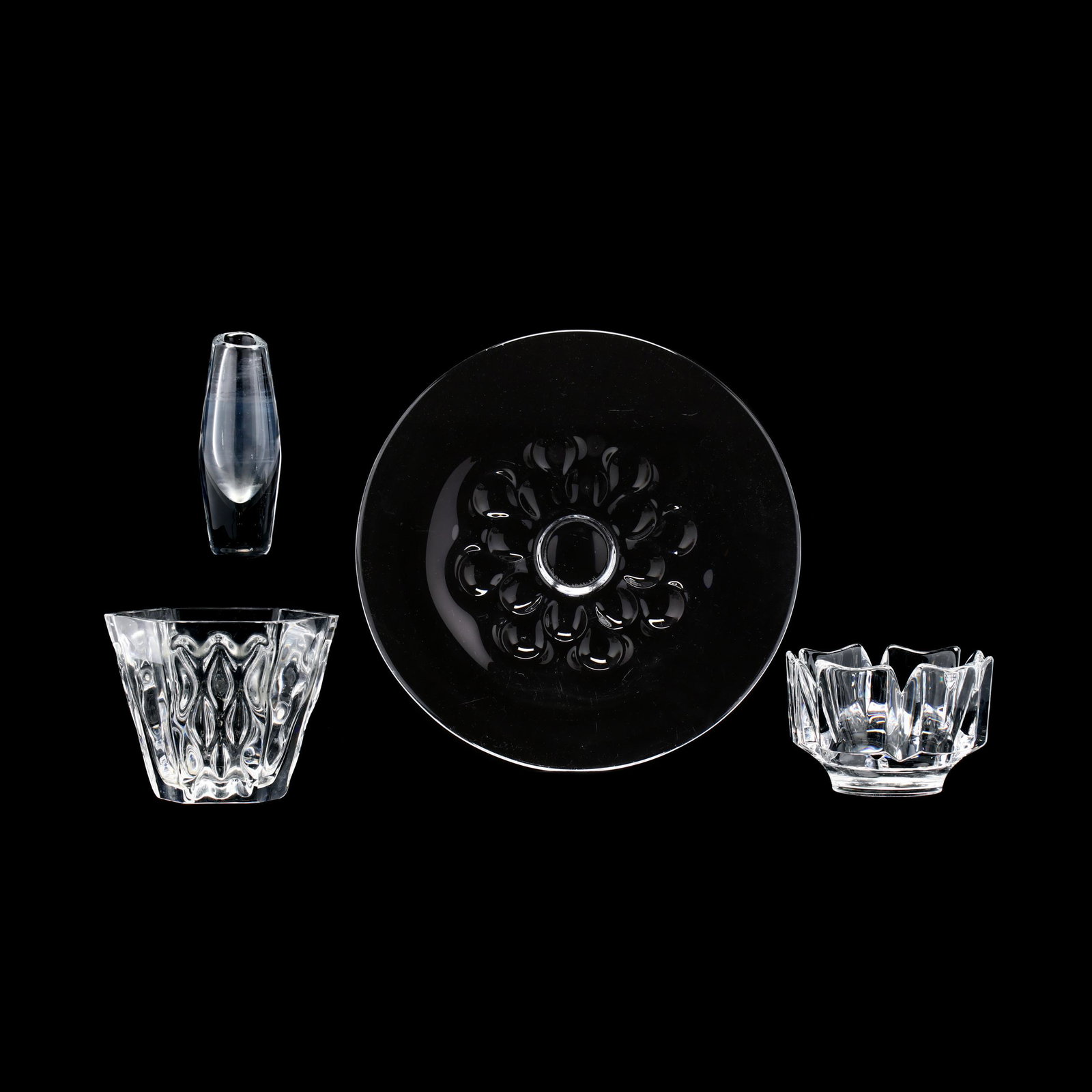 Four Pieces of Orrefors Crystal: Four Pieces of Orrefors Crystal Sweden, mid 20th century, colorless crystal, including a circular plate, bud vase, and two serving bowls, each signed. Plate 13 in. Additional high-resolution photos ar