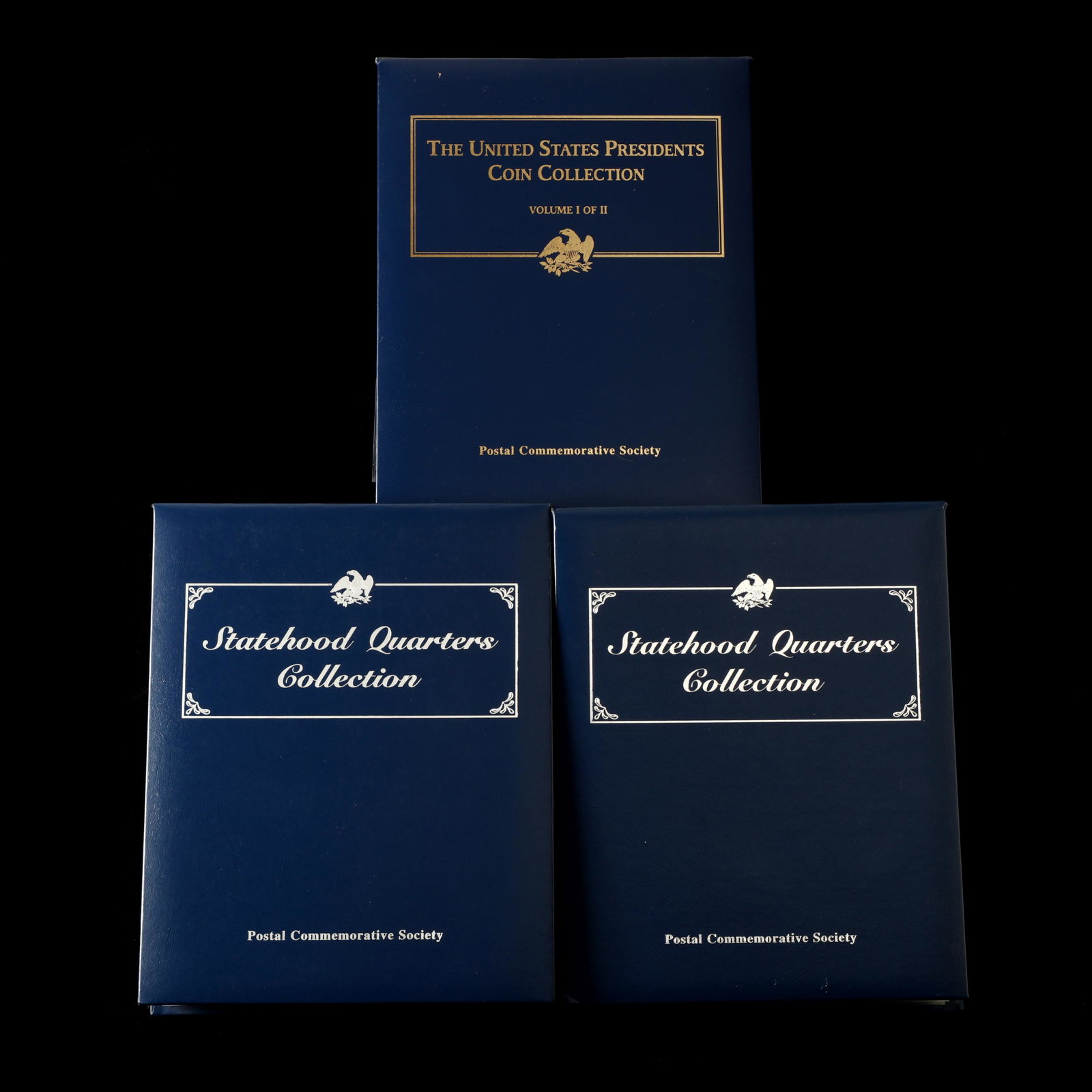 Complete Set of State Quarters and Set of the First: Complete Set of State Quarters and Set of the First Nineteen Presidential Dollars in three albums produced for the Postal Commemorative Society, coins from Philadelphia and Denver are mounted in a pri