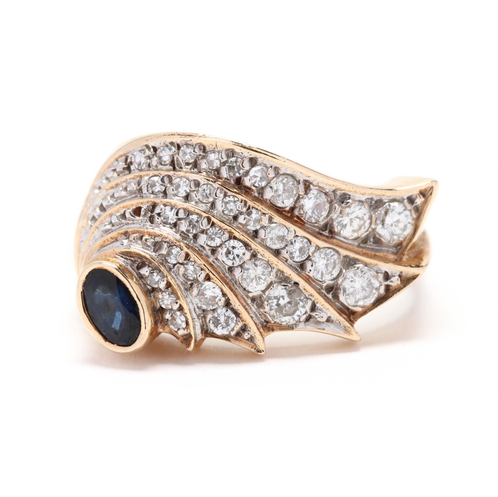 14KT Gold Diamond and Sapphire Ring, Erte for Circle: 14KT Gold Diamond and Sapphire Ring, Erte for Circle Fine Artfrom the "Dream Voyage" collection, in a stylized wing motif centered on a bezel set oval cut sapphire with layered rows of round full cut