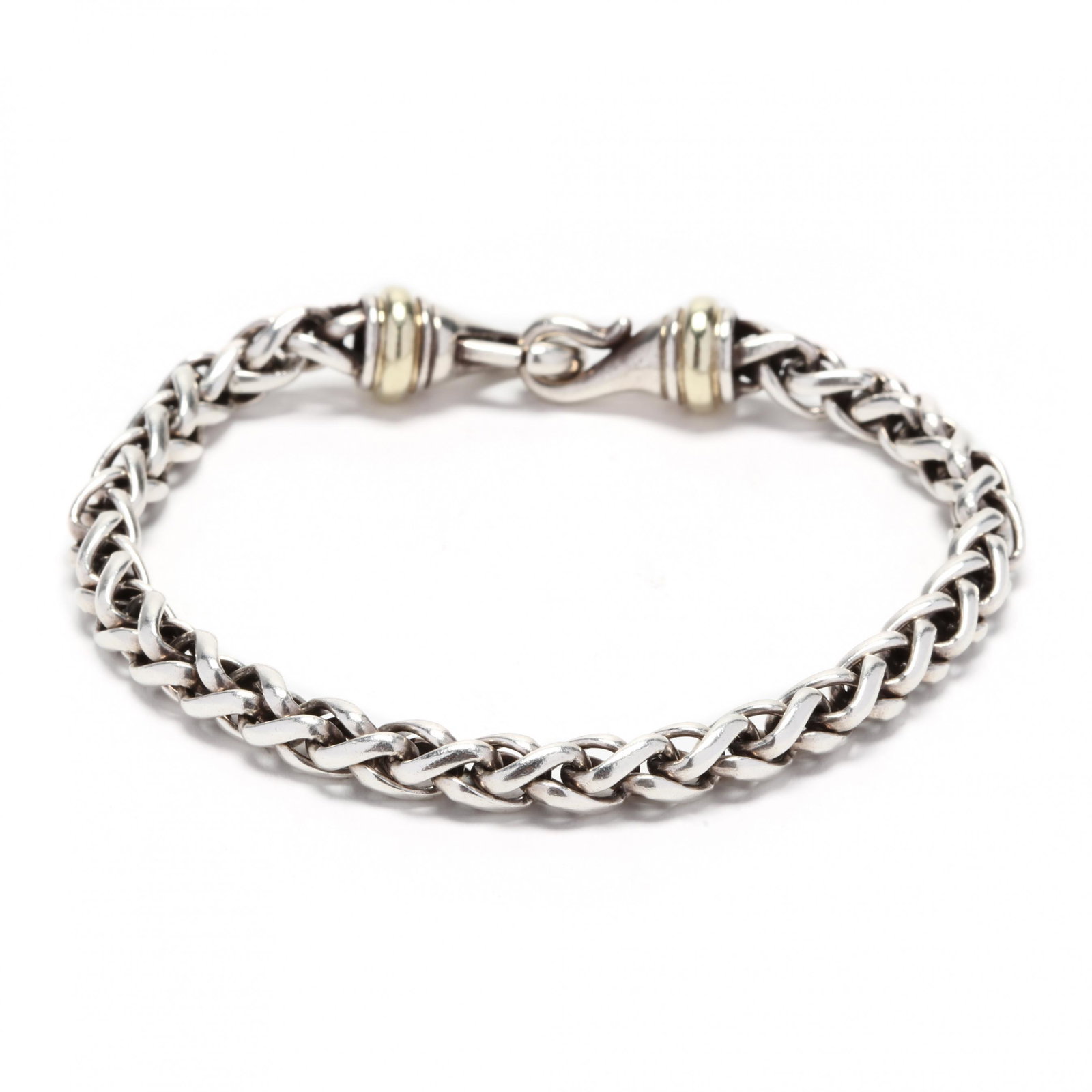 Sterling Silver and 14KT Gold Bracelet, David Yurman: Sterling Silver and 14KT Gold Bracelet, David Yurman the sterling wheat chain completed with a lobster clasp with gold ring accents, with maker's mark and stamped 925 / 585. 6mm x 8.5 in. .83 troy oz.