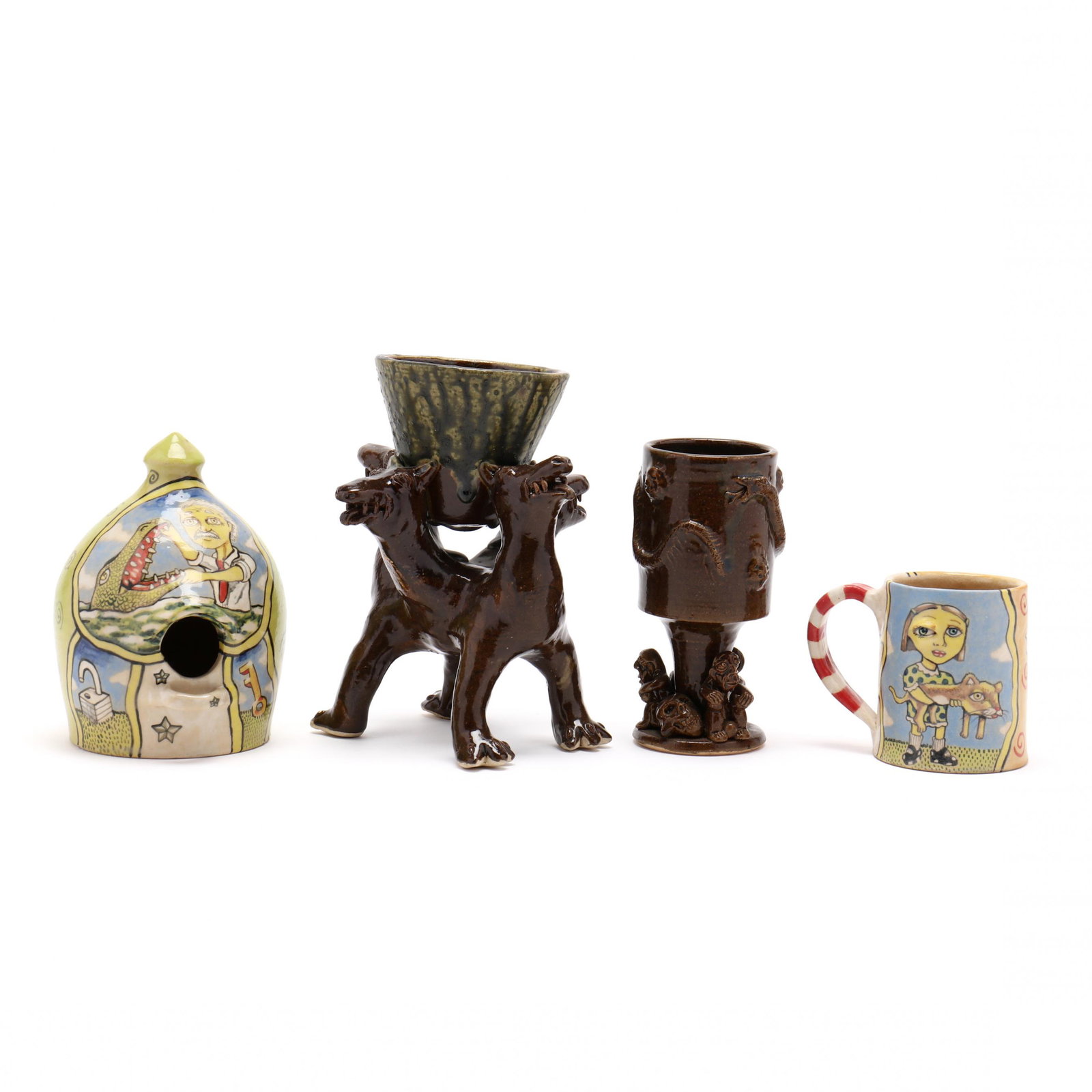 NC Folk Pottery, Stacy Lambert, Four Works: NC Folk Pottery, Stacy Lambert, Four Works first, a polychrome mug decorated with a lady holding a cat (3.75 in.) and second, a birdhouse featuring a man with an alligator, (6.75 in.) each having a ve