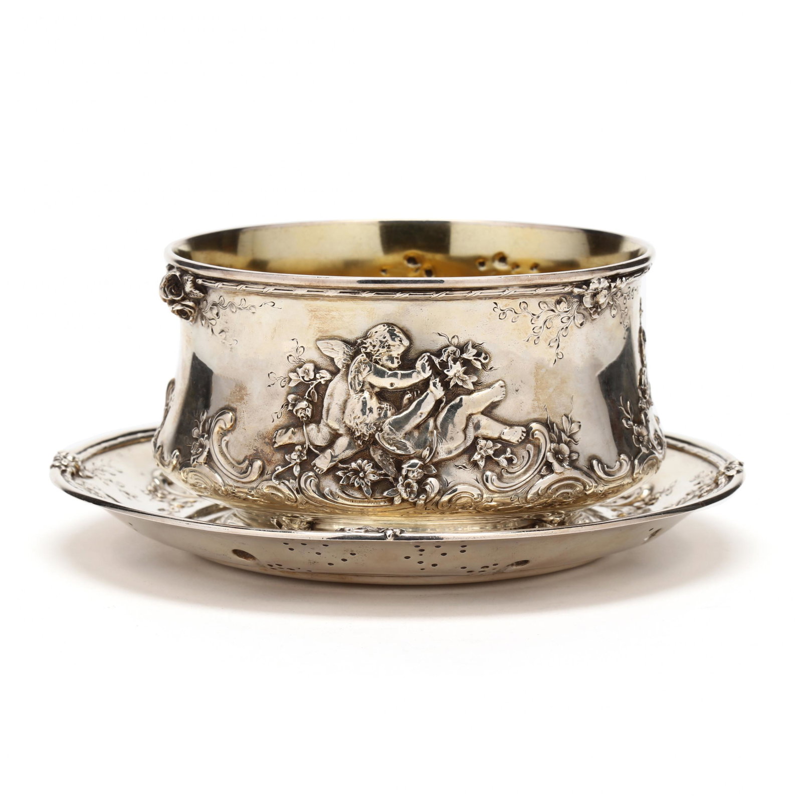Tiffany & Co. Sterling Silver Bowl and Underplate: Tiffany & Co. Sterling Silver Bowl and Underplate circa 1902-1907 period hallmark, pattern number 9679, in a Rococo Revival style with cupids cavorting amidst floral scrolls, the bowl parcel gilt, no 