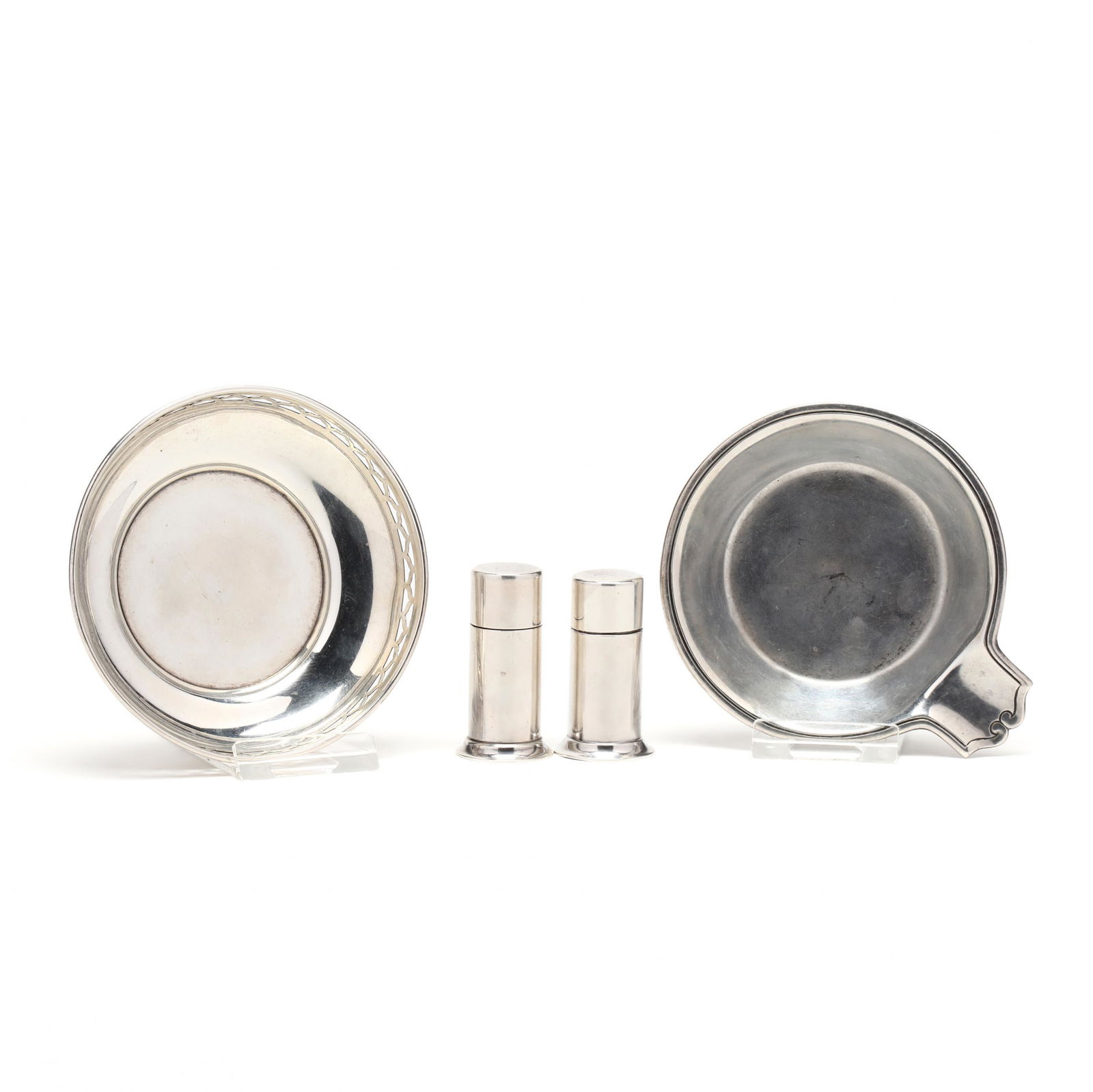 Four Tiffany & Co. Sterling Silver Table Accessories: Four Tiffany & Co. Sterling Silver Table Accessoriesincluding a pair of lipstick form salt & pepper shakers, pattern number 23670 (2 in.); an ash tray with circa 1907-1947 period hallmark and pattern