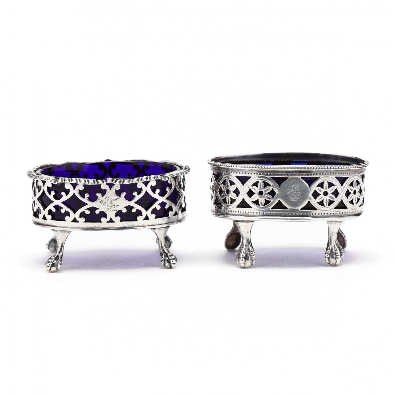 A Near Pair of George III Silver Master Salts: A Near Pair of George III Silver Master Salts the first with mark of David Hennell and Robert Hennell, London (1768), with period armorial engraving, raised on ball and claw feet (1.75 x 3.25 x 2.5 in