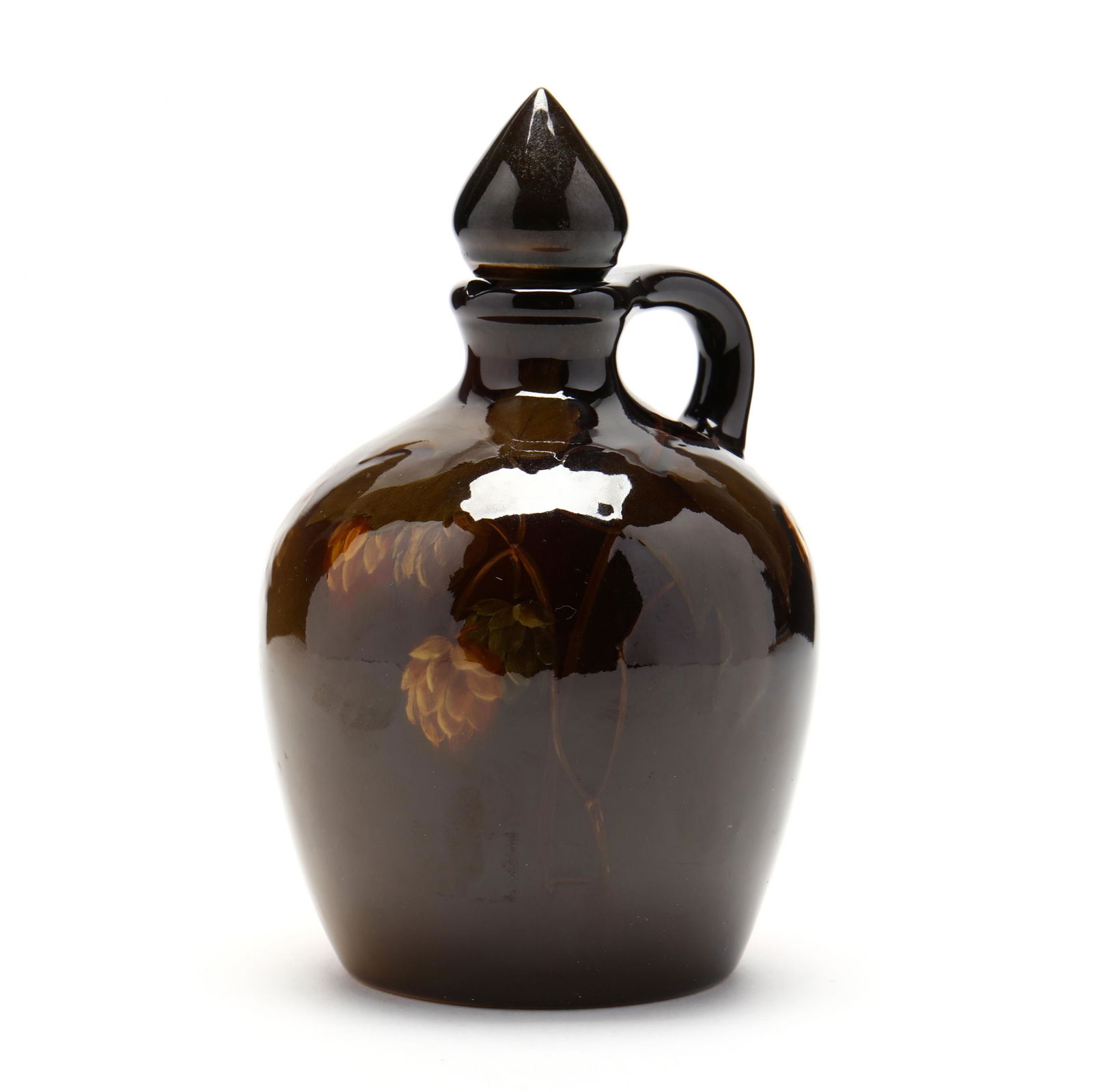 Rookwood Whiskey Jug by Sara Sax: Rookwood Whiskey Jug by Sara Saxcirca 1899, standard glaze with hand-painted floral and foliate decoration, shape number 512, size C, marked to underside, with stopper. 7.5 in. From the Collection of