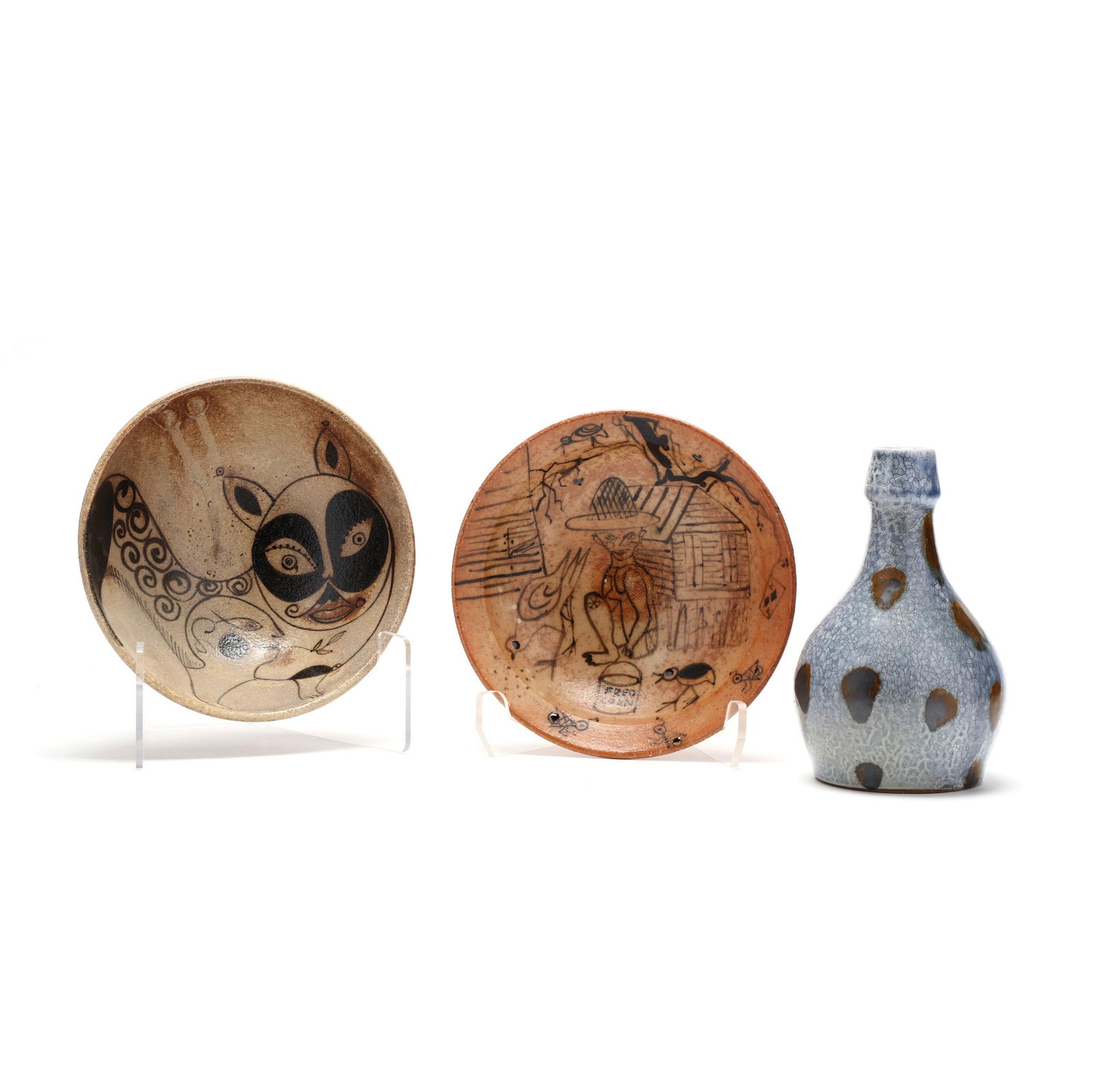 NC Pottery, Fred Johnston, Seagrove: NC Pottery, Fred Johnston, Seagrovewood-fired stoneware, a bottle vase and two bowls, each bowl with slip caricature. Vase 8.5 in.; Larger Bowl 3.25 x 8.75 in. Collection of John Davis, Durham, North