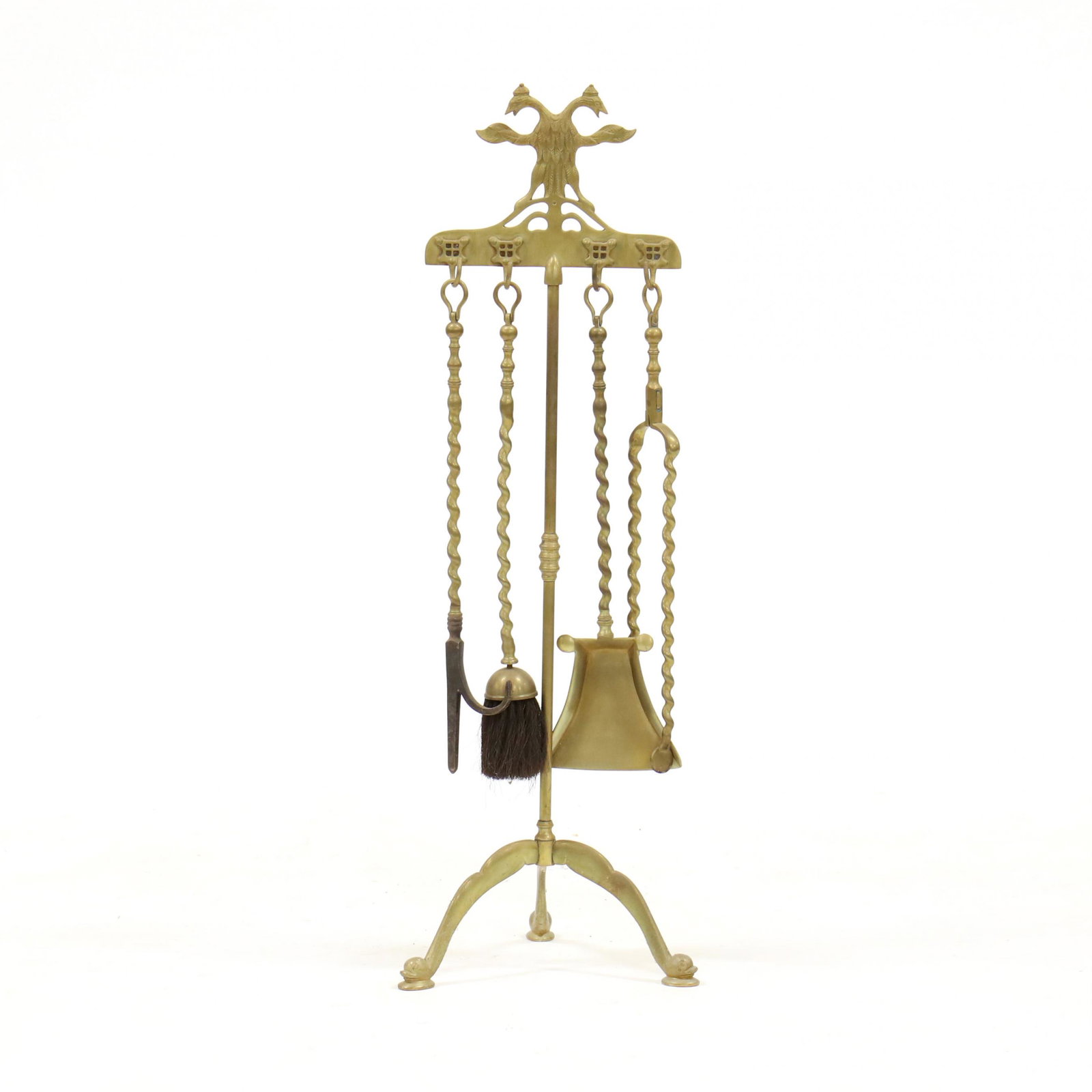 Continental Brass Fireplace Tool Set: Continental Brass Fireplace Tool Set mid 20th century, including a double-headed eagle stand with four spiral twist brass tools, on dolphin feet. HOA 37 in. From the Collection of John Ehle and Rosema