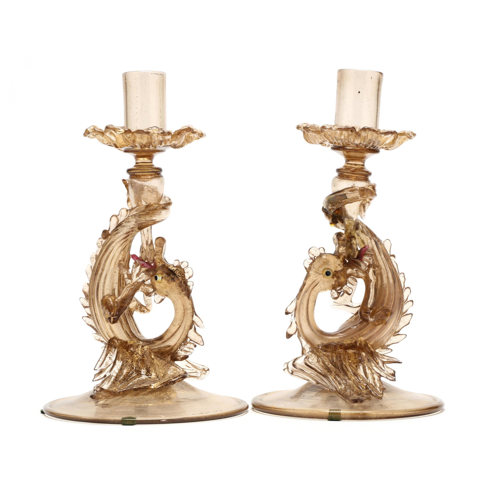Pair Murano Glass Candlesticks: Pair Murano Glass Candlesticks 1960s, likely Salviati, blown smoky glass with gold flecks, tooled work forming dragon supports on conical raised foot with curled rim, unmarked. 9.5 in. Additional high