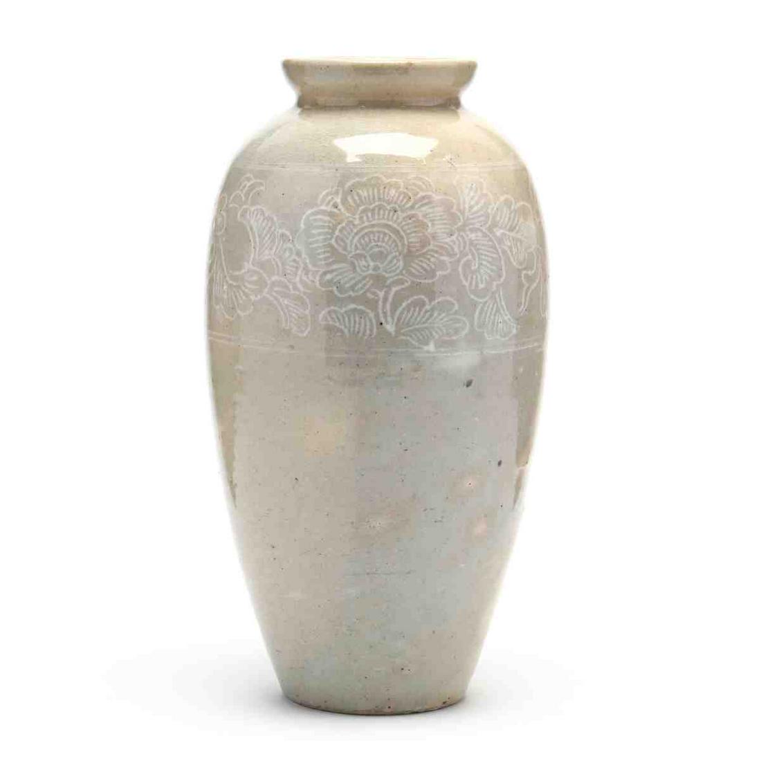 An Asian Large Jar with Peony Decoration: An Asian Large Jar with Peony Decoration 20th century, Chinese or Korean, light cream tan glaze ground with large peonies outlined in white within a double line border band at upper body section of ja