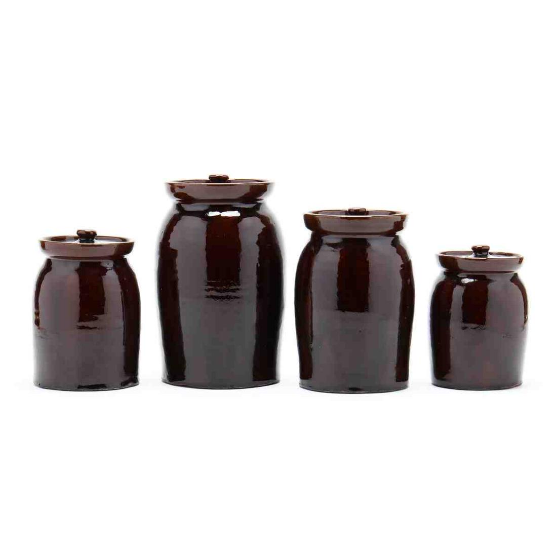 NC Pottery, A Joe Owen Four Piece Canister Set: NC Pottery, A Joe Owen Four Piece Canister Set brown glaze, four graduated lidded canisters (tallest 9.25 in., all inscribed with "Joe Owen" script signature. Estate of the late Stuart Pendergraft Whi