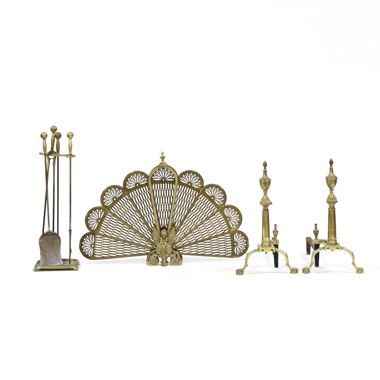 Vintage Brass Fireplace Grouping: Vintage Brass Fireplace Grouping mid 20th century, including a 'peacock' reticulated brass fireplace screen with winged griffins; a pair of Chippendale style andirons by Harvin Co.; and a three piece 