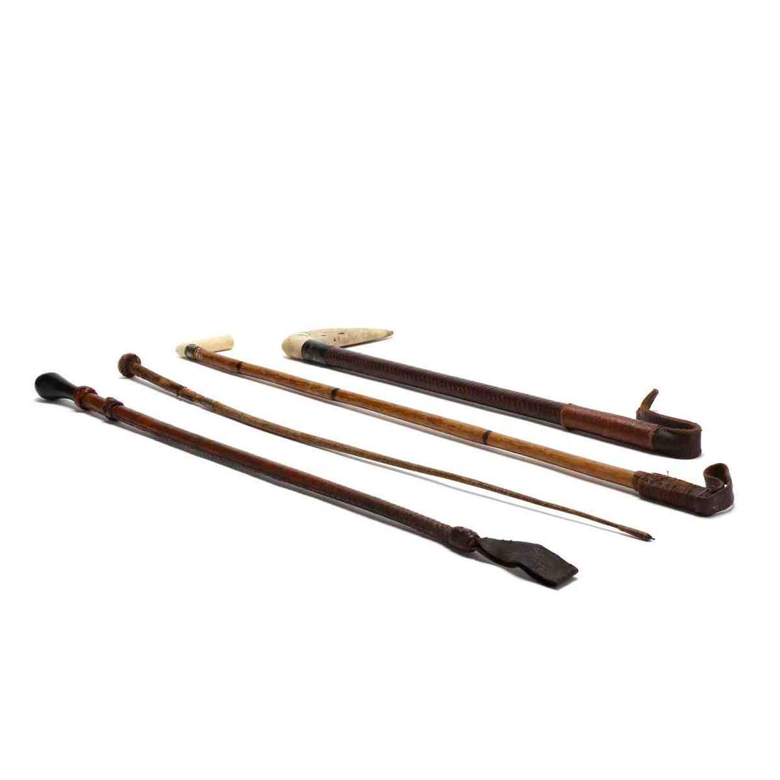 Four Antique Crops: Four Antique Crops 19th and early 20th century, including a stag handled crop with sterling ferrule marked Swaine; a bone handled bamboo crop; a steel lined crop marked Merle & Co.; and an ebony handl