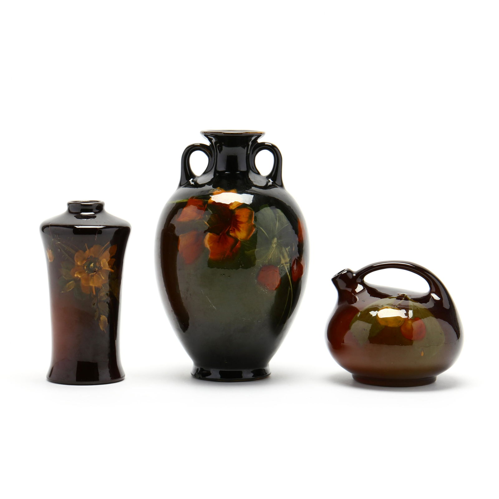 Three Early Roseville Rozane Pottery Vessels: Three Early Roseville Rozane Pottery Vesselscirca 1900, hand painted floral decoration, two are marked Rozane, the largest with illegible inscription; the shorter vase with illegible artist's signatur