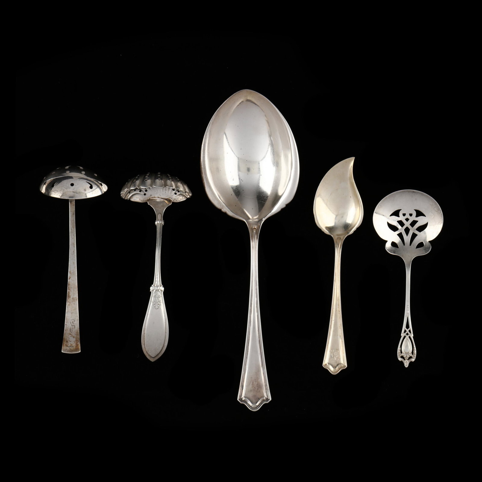 Five Antique American Sterling Silver Servers: Five Antique American Sterling Silver Servers including (2) pierced ladles; a jelly server; a bon bon scoop; and a casserole serving spoon. Various monograms and manufacturers. 6.1 total troy oz. Priv