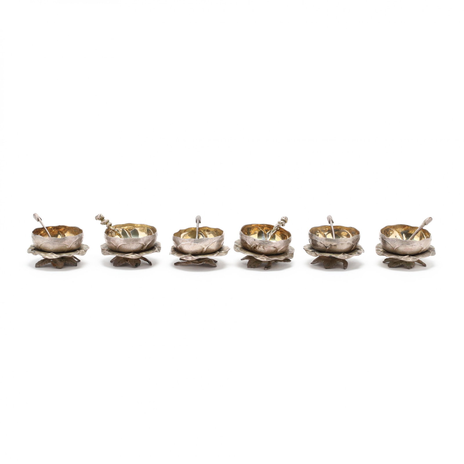 Victorian Silver Master Salt Service: Victorian Silver Master Salt Service mark of "C & Co." in a rectangular punch, Sheffield (1866), including six parcel gilt flower form salt cellars and four leaf form salt spoons, presented in the ori