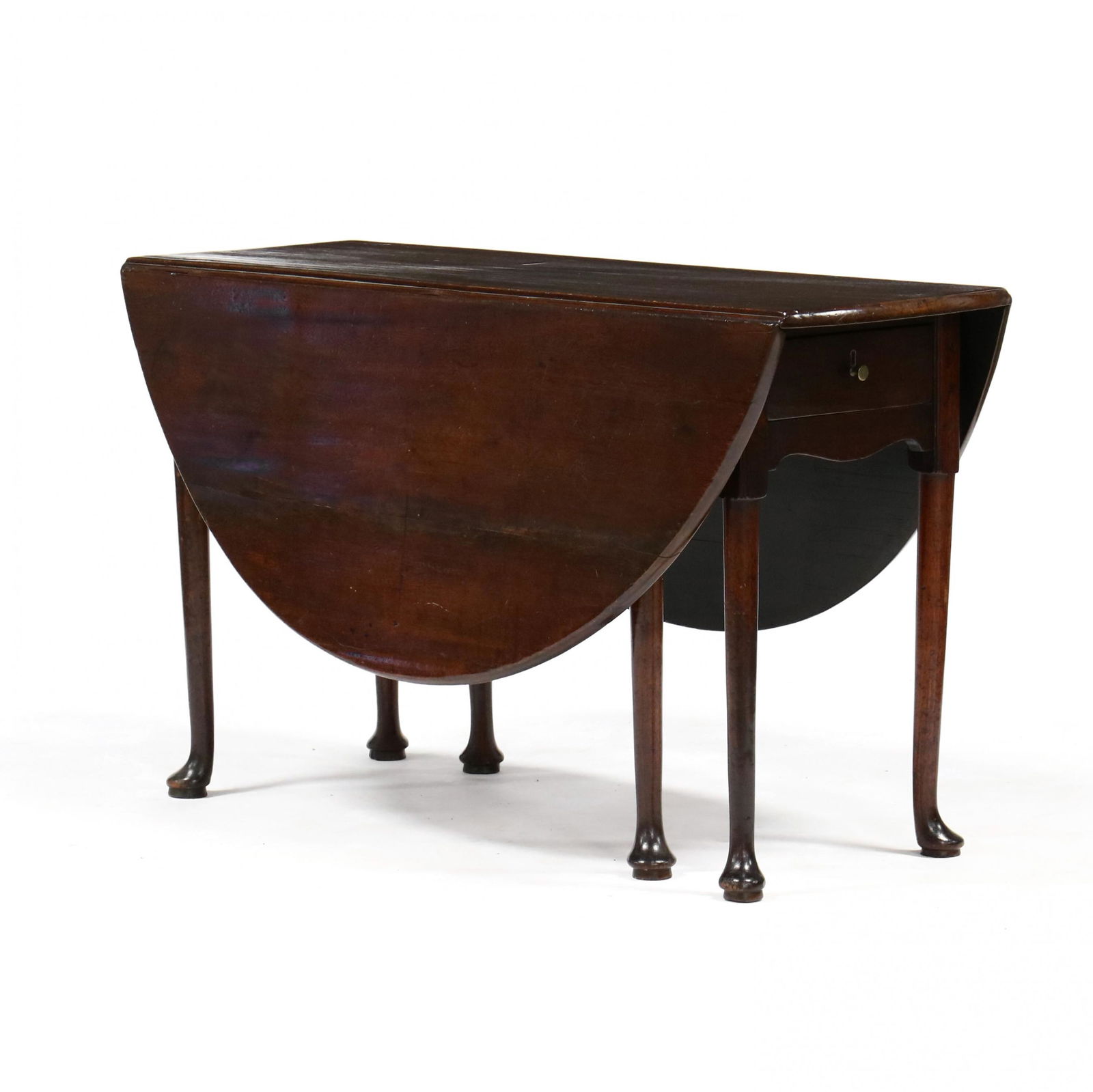 Southern Queen Anne Mahogany Drop Leaf Dining Table: Southern Queen Anne Mahogany Drop Leaf Dining Tablelate 18th century, red pine and sugar maple secondary, single board top, drop leaves with gate-leg support, single drawer, shaped skirt, raised on si