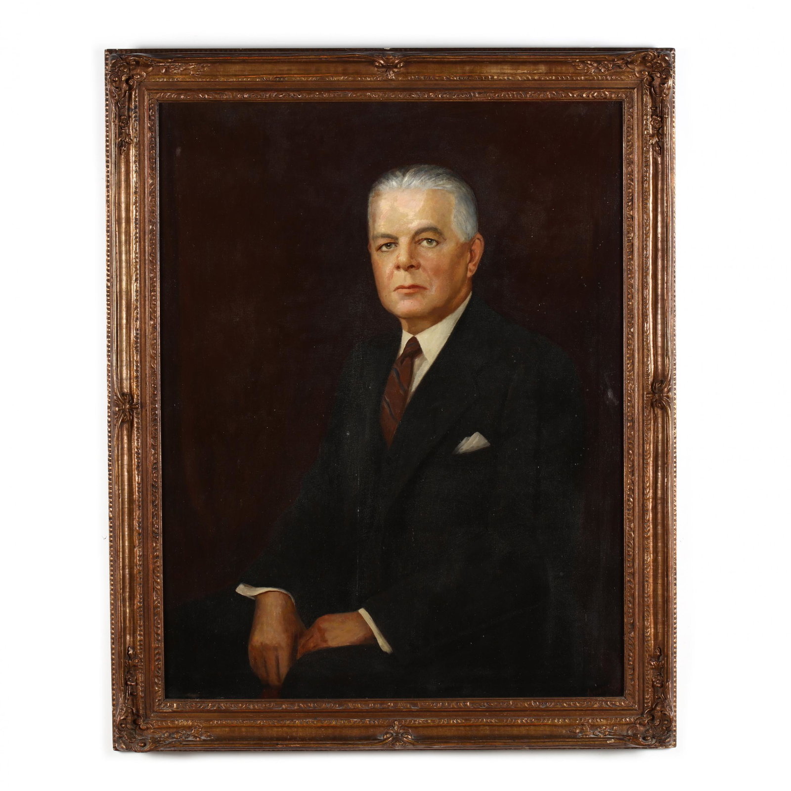 Augustus May (American, 20th century), Portrait of a: Augustus May (American, 20th century), Portrait of a Businessman oil on canvas, signed and dated 1961 at lower right, half length portrait of a man in a suit and tie with pocket square, presented in a